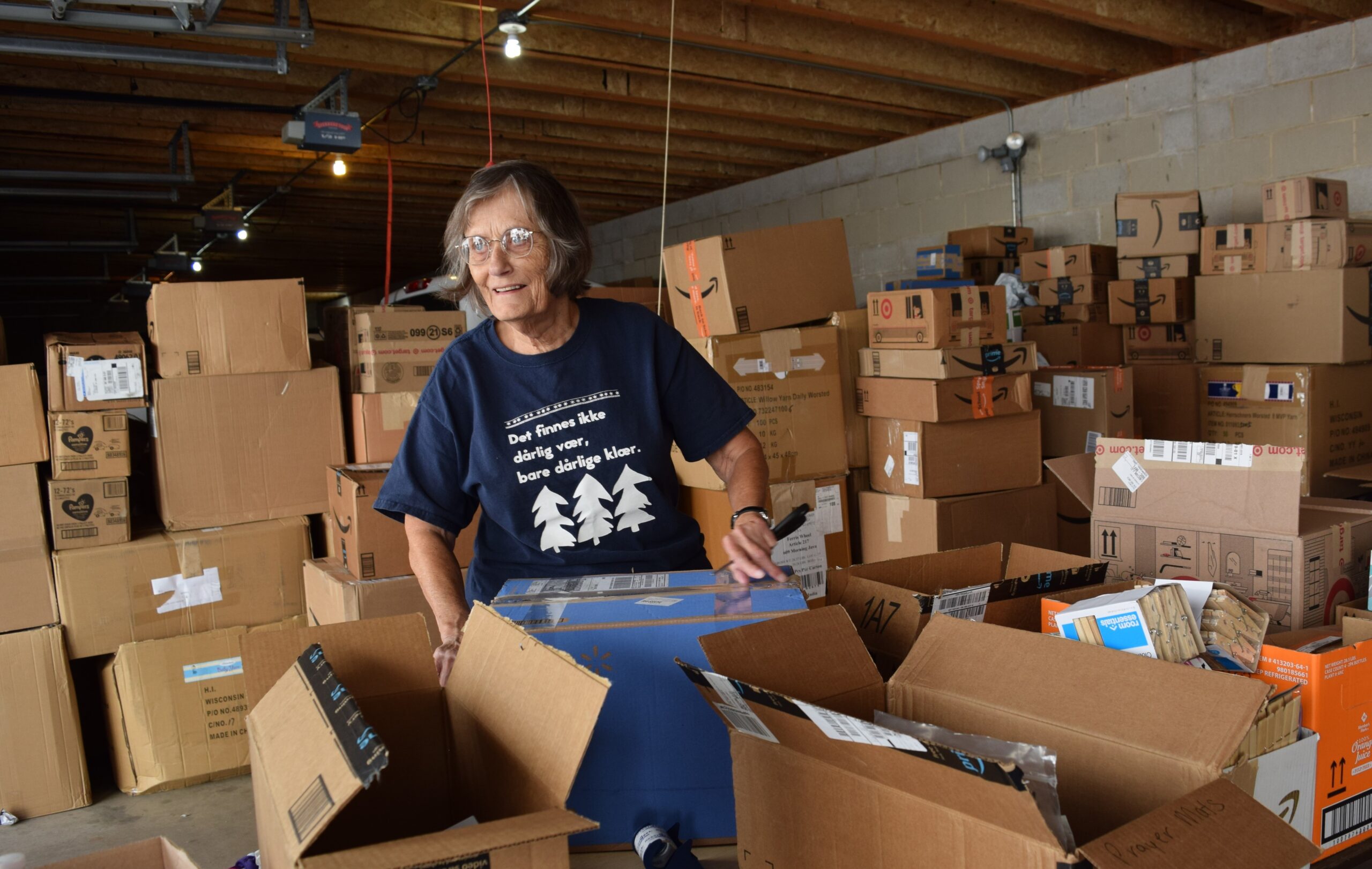 Catholic Charities volunteer sorts donations for Afghan refugees