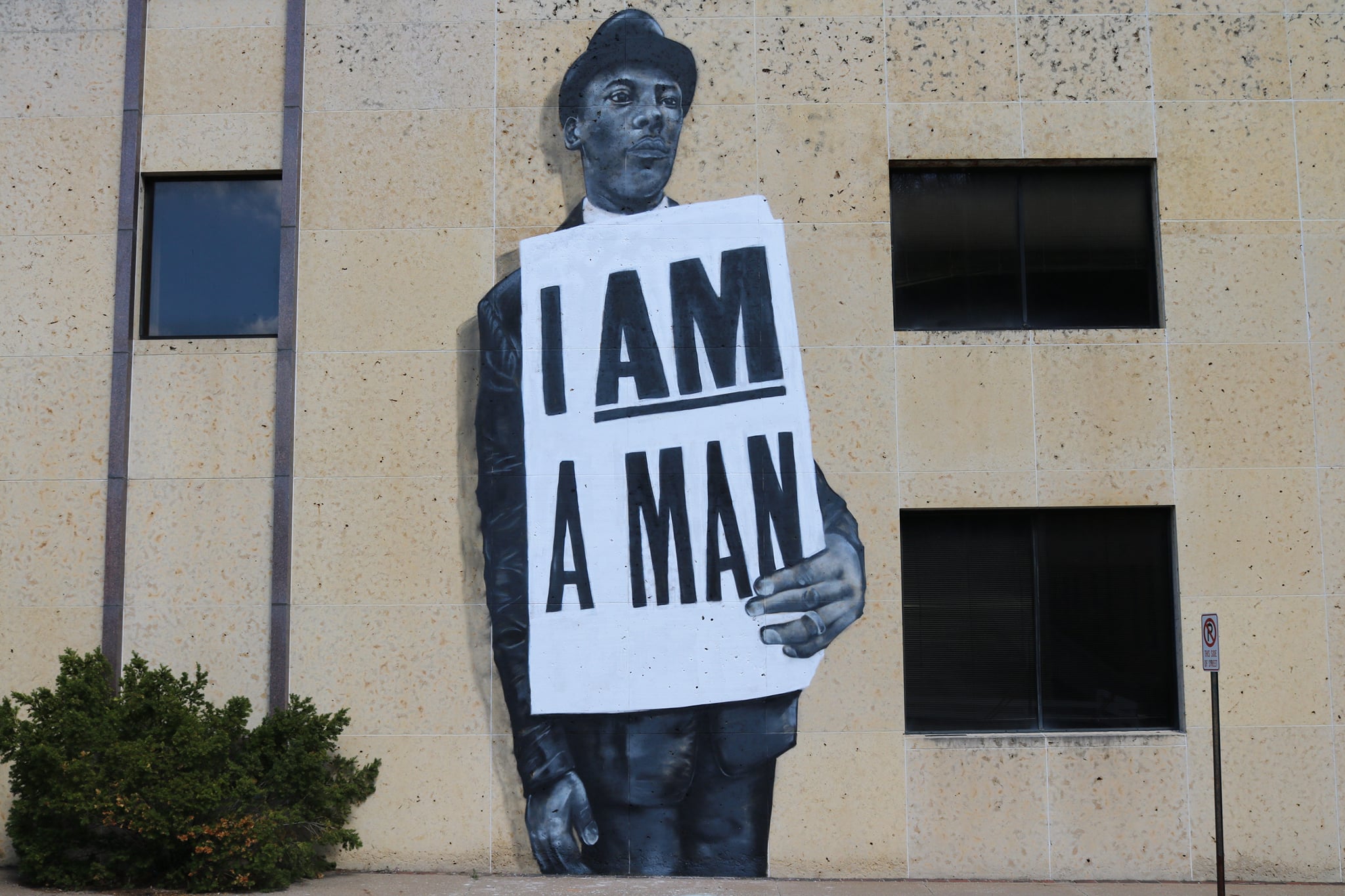 A Temporary exhibition of Dana Harrison's "I Am A Man" mural appears at the corner of Bluff & 8th Streets in downtown Dubuque; Image courtesy of Dubuque Museum of Art, August 2021