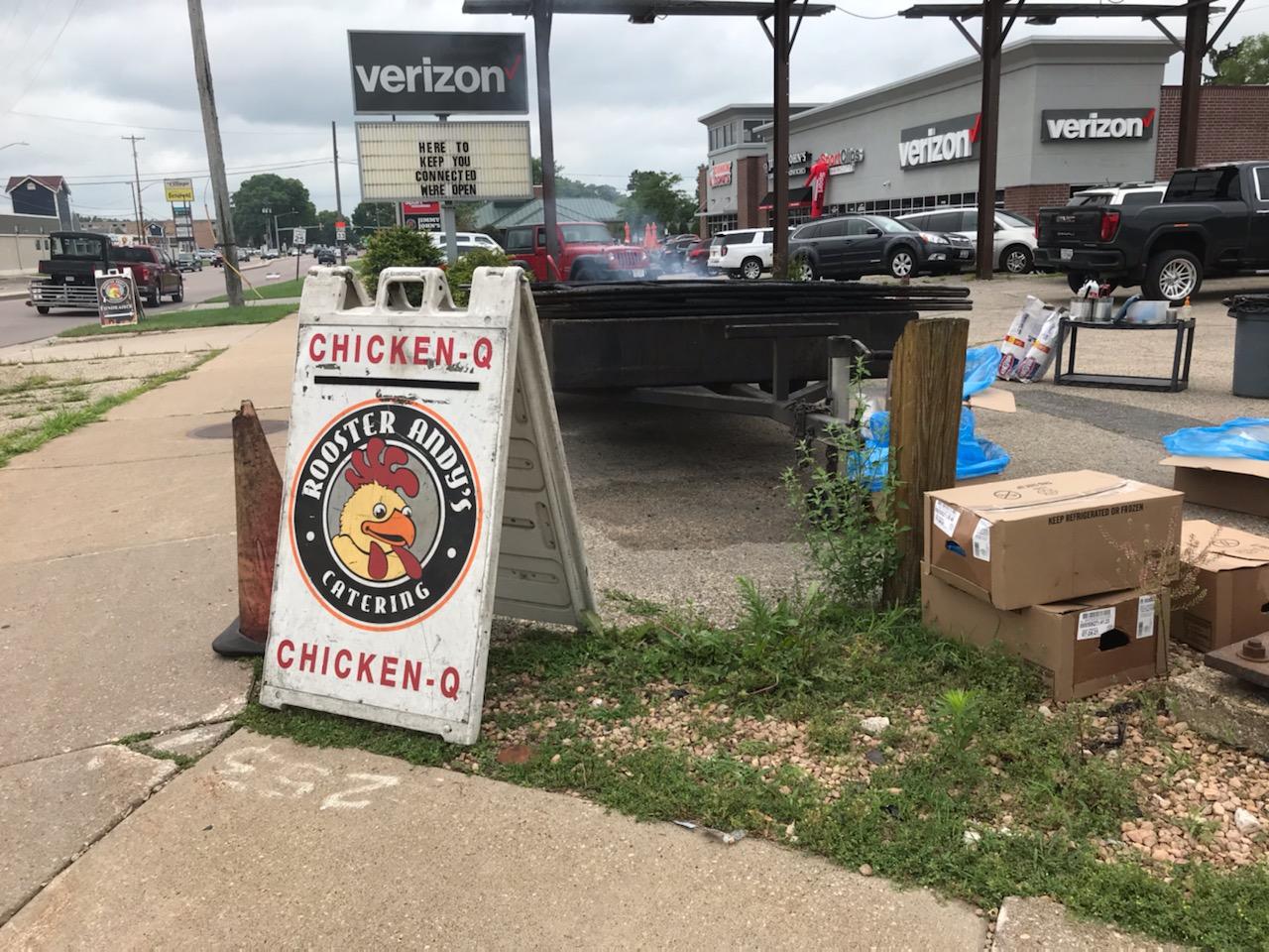 A typical set up advertising a Chicken Q event. It's the scent of grilled chicken that helps bring customers in