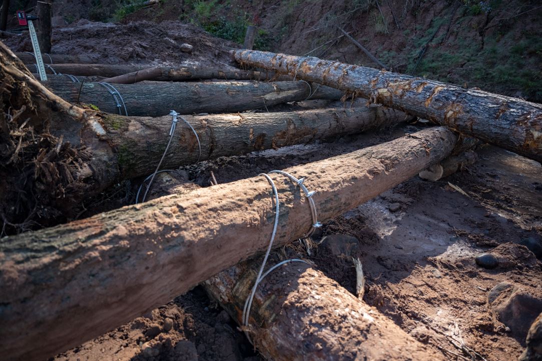 Logs installed to stabilize Fish Creek's eroding bluffs