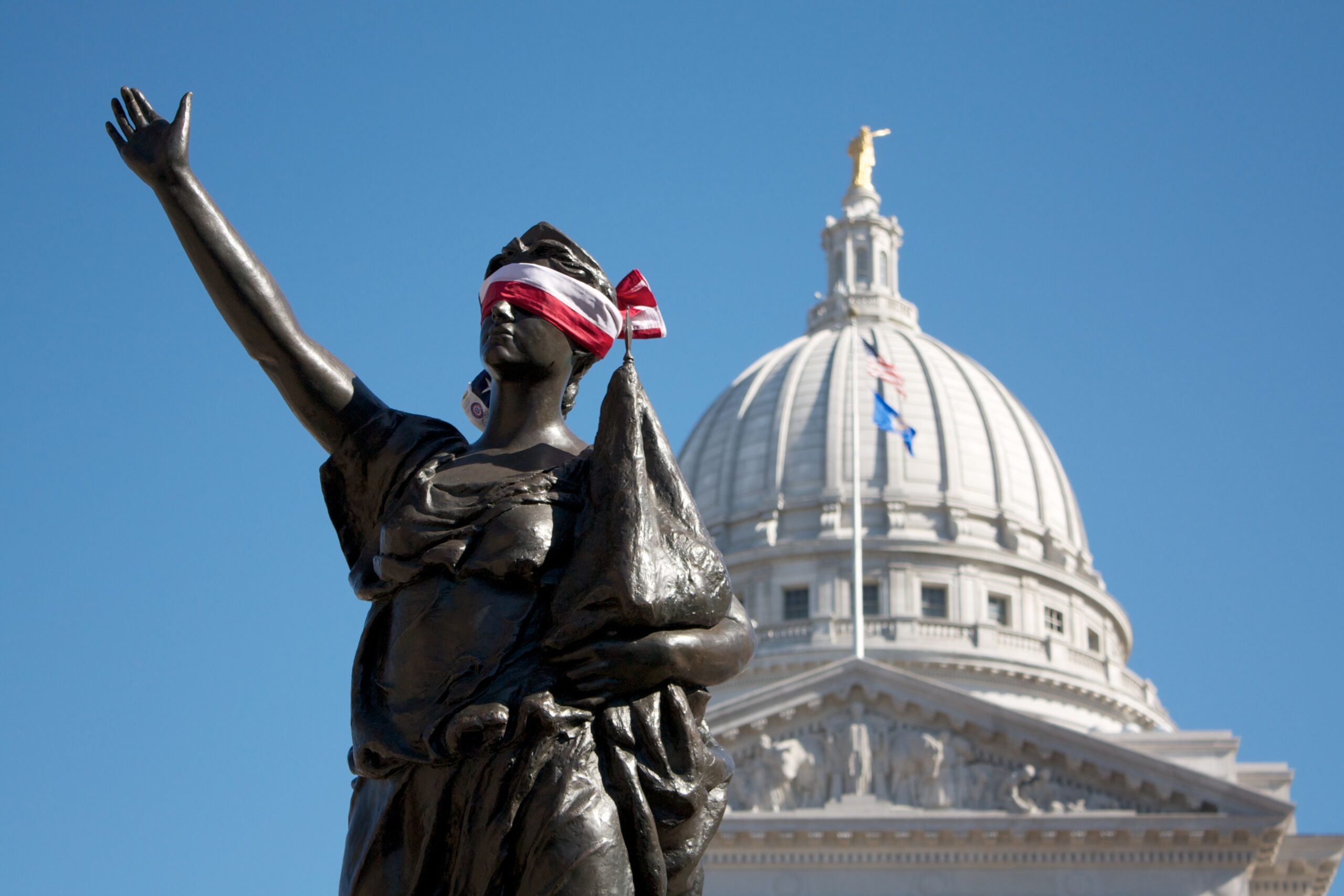 Blindfolded statue in front of Wisconsin Capitol