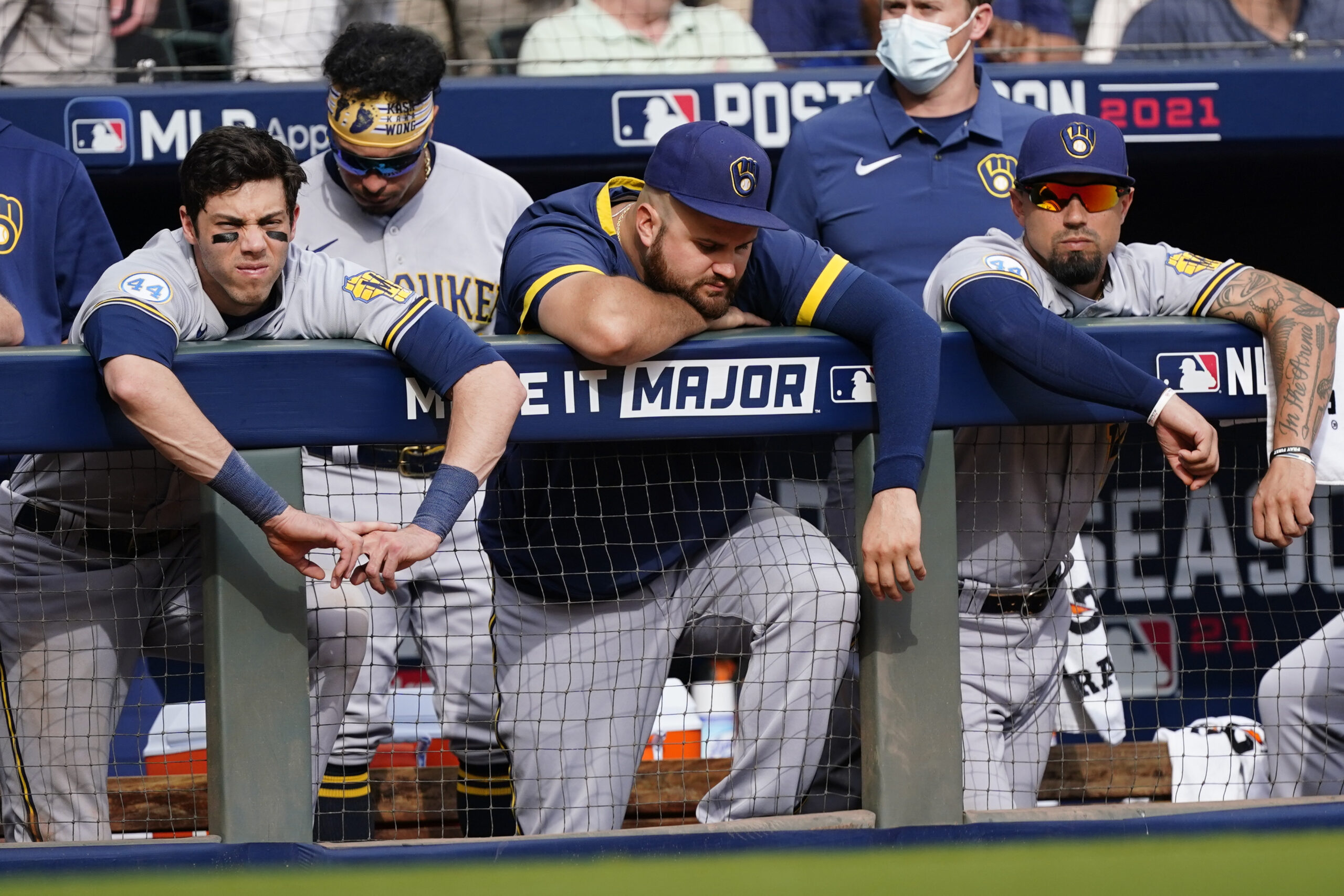 Brewers players watch game from dugout