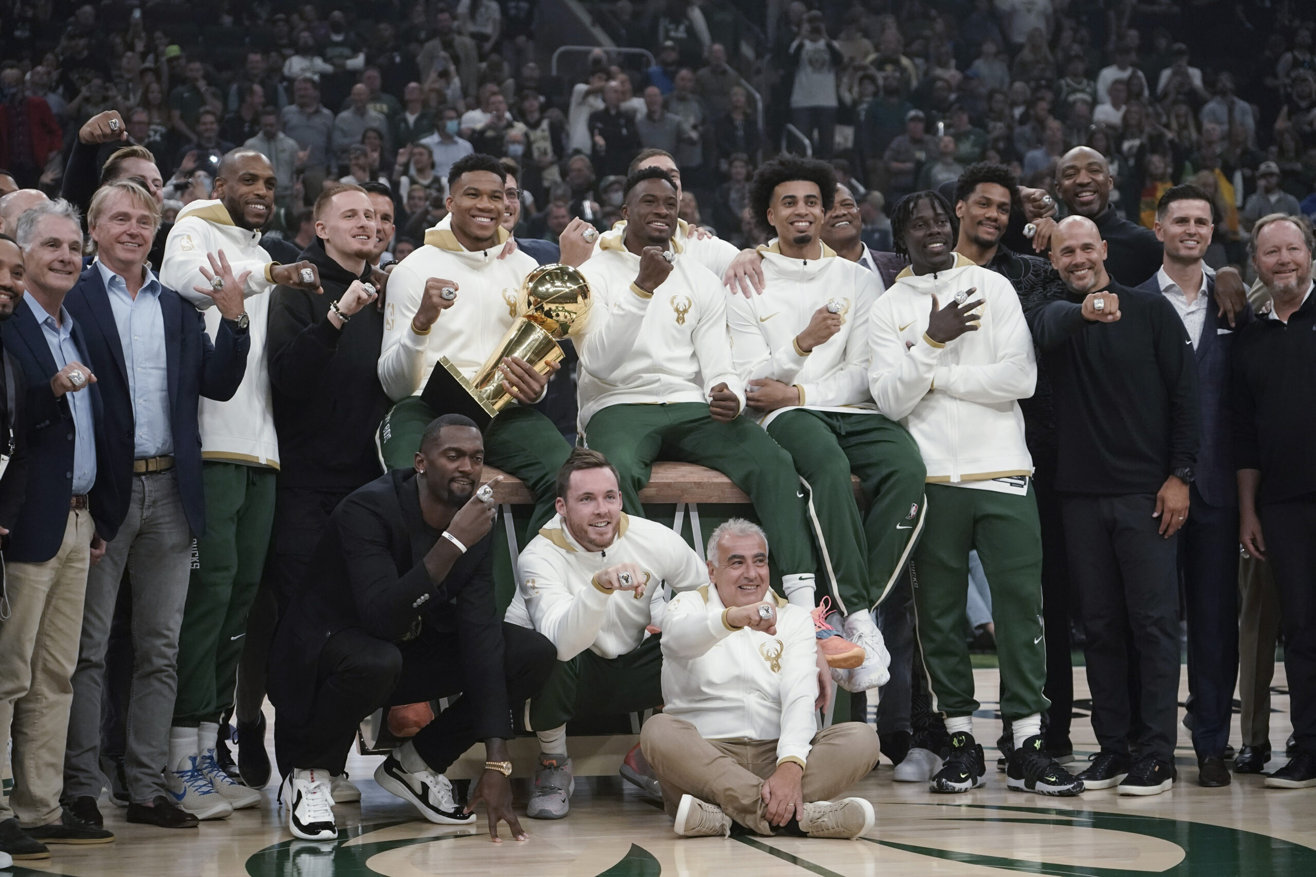Milwaukee Bucks owners and players display their championship rings before a NBA basketball game