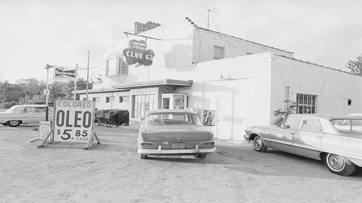 A car is parked just across state lines in Illinois at an impromptu dealer selling colored oleomargarine