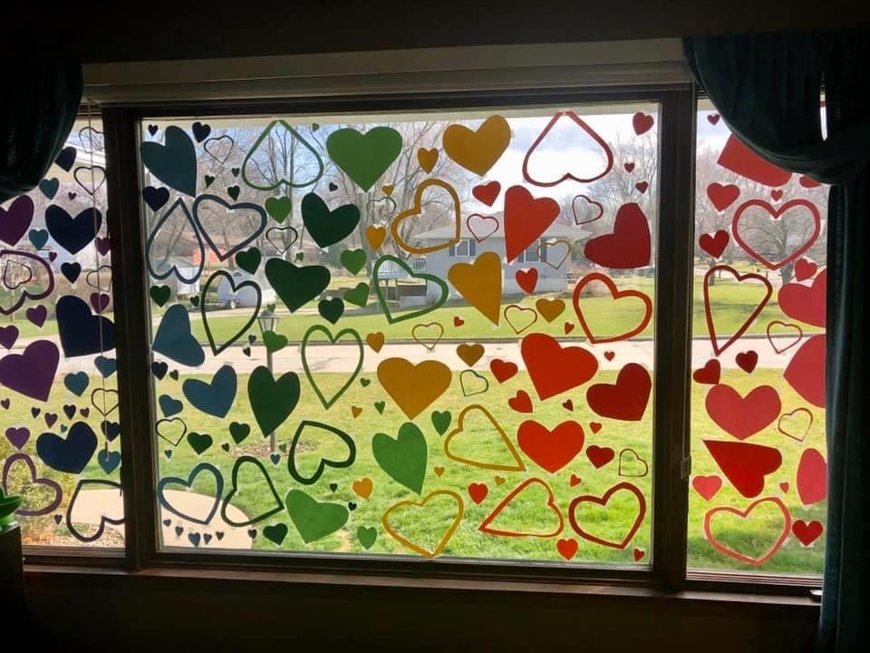 Hearts on a window are on display at a home in Grinnell, Iowa