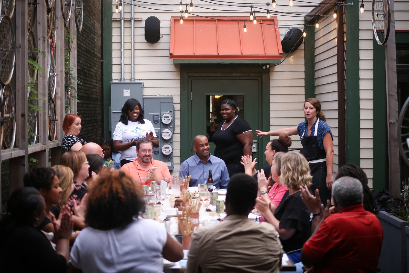 People sit around a dinner table