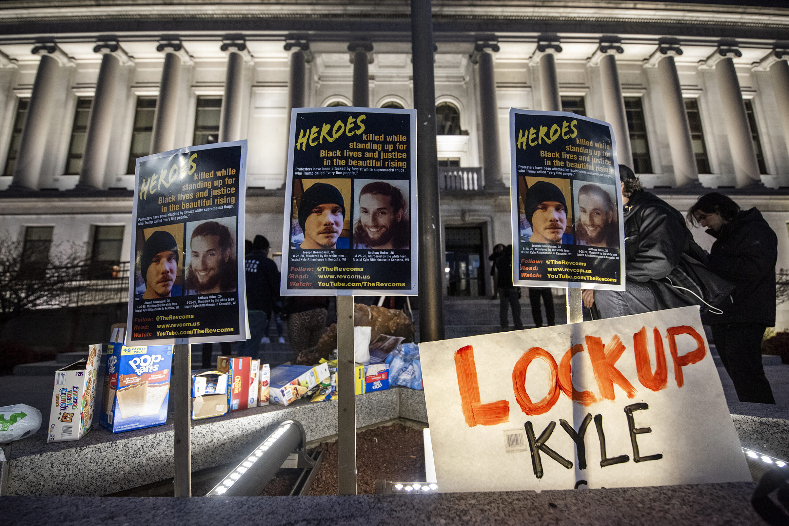 The faces of Anthony Huber and Joseph Rosenbaum are posted on signs outside the courthouse