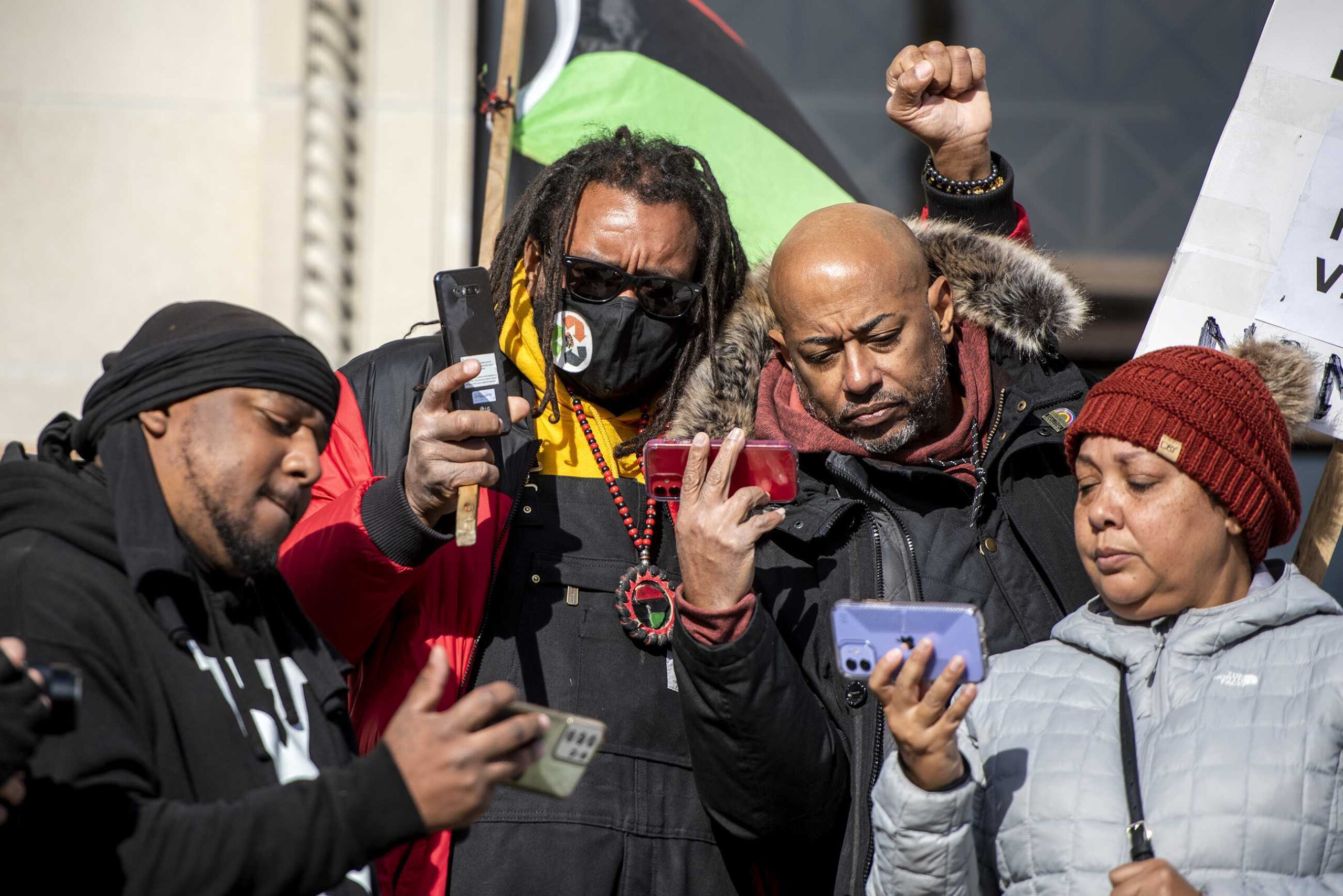 Justin Blake, center, Jacob Blake’s uncle, stands with fellow protesters on the steps of the Kenosha County Courthouse