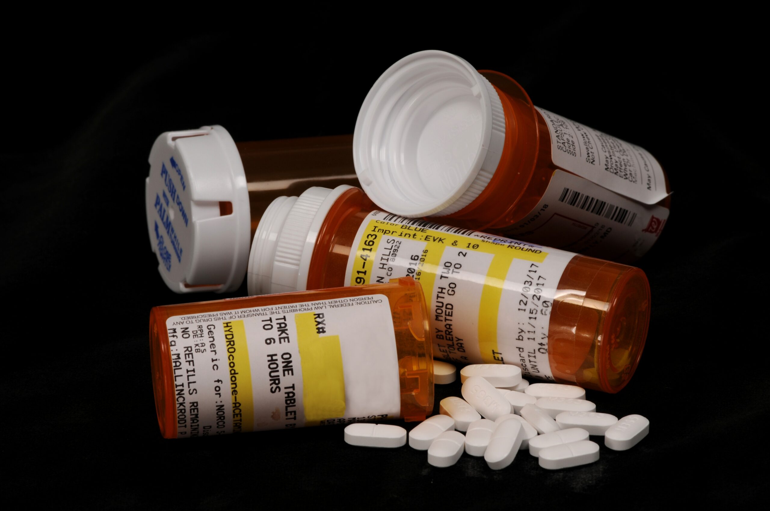 Opioids and prescription medicine bottles.