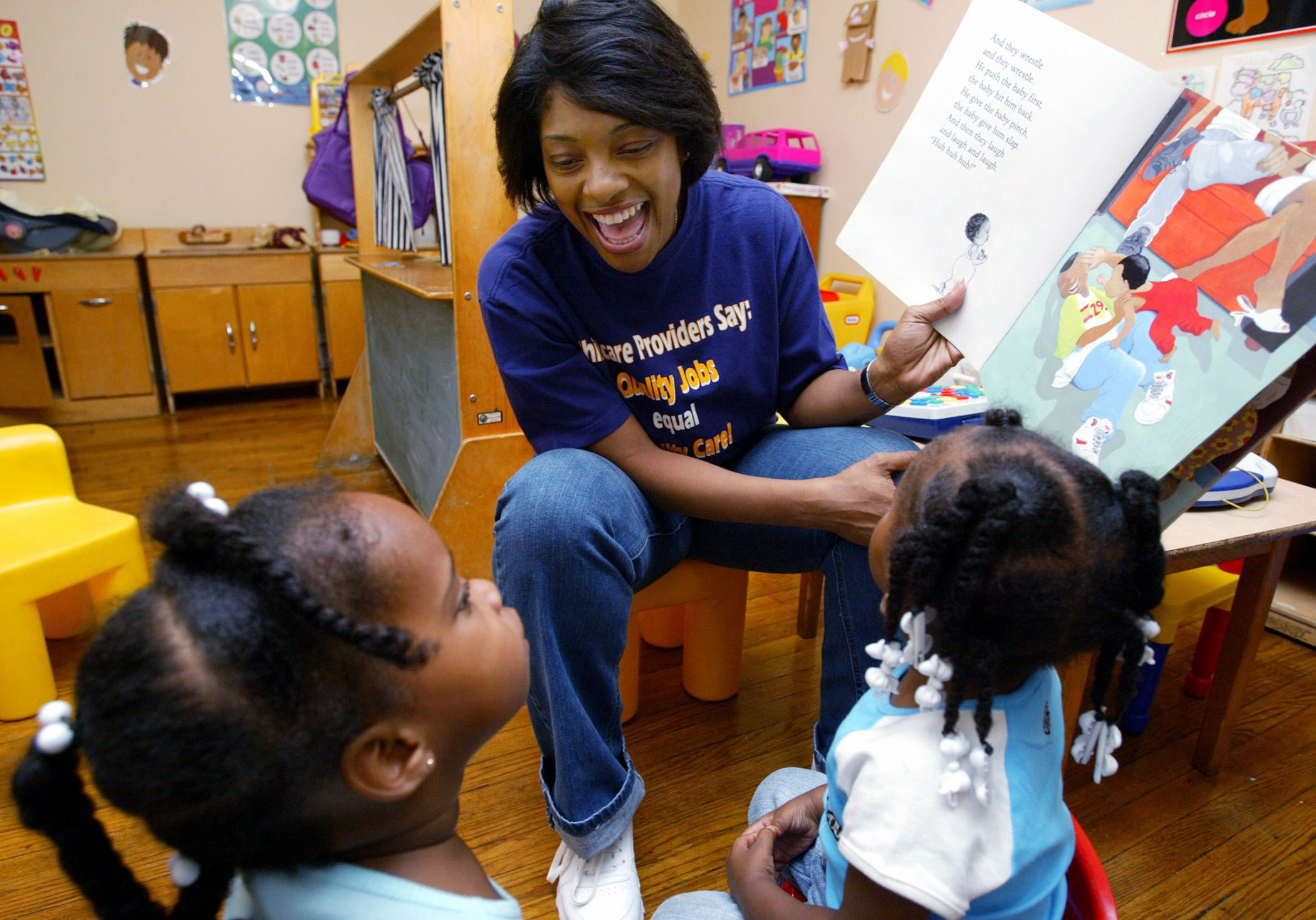 Child care worker reading a book