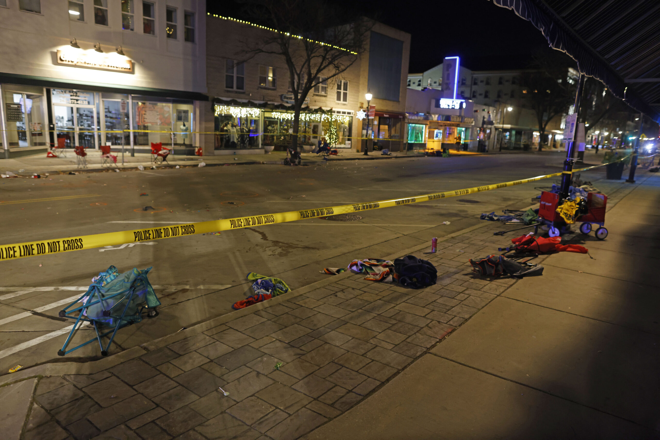 Police tape cordons off a street in Waukesha after an SUV plowed into a Christmas parade