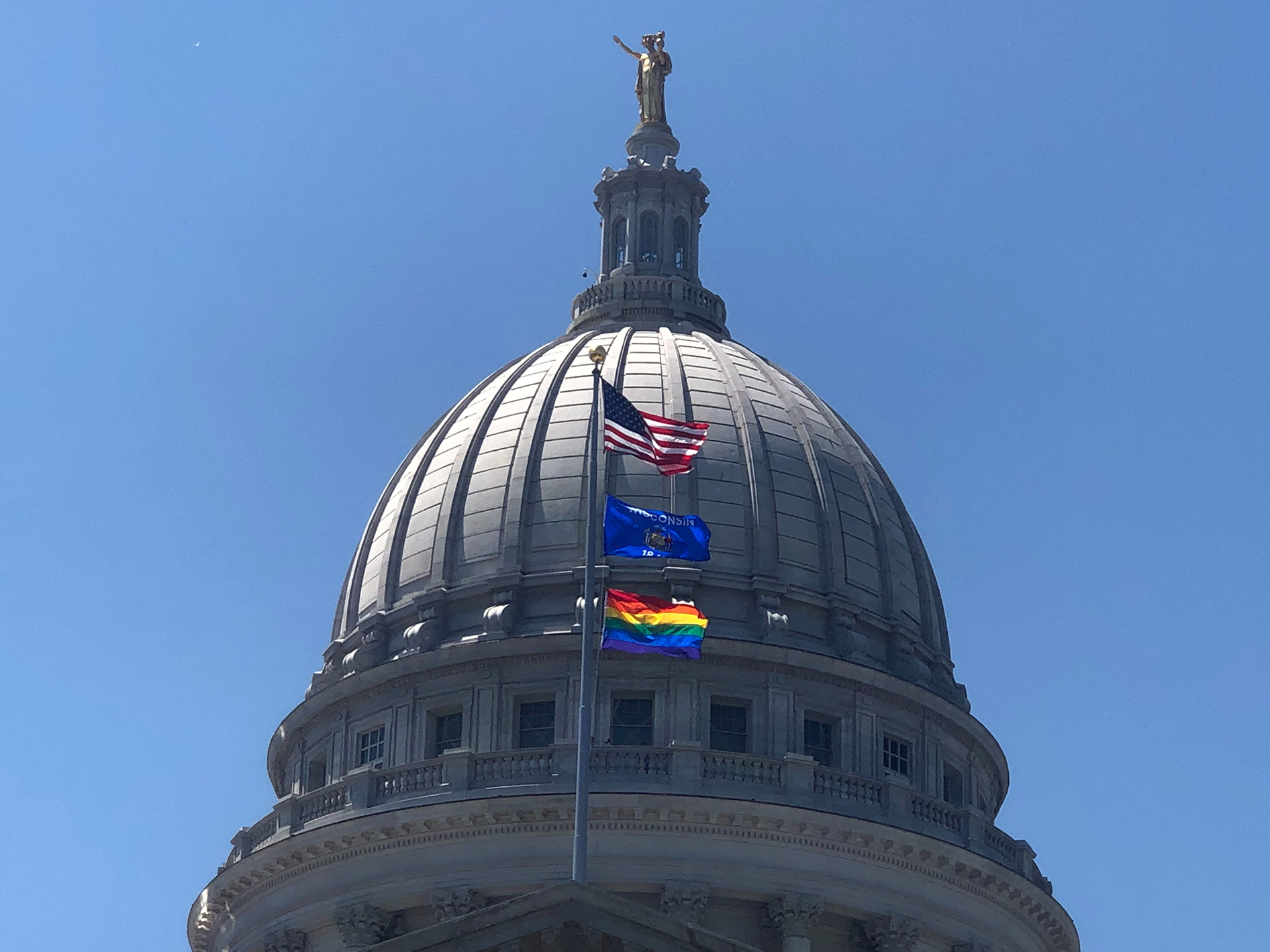 A rainbow flag flies over the state Capitol in recognition of "Pride Month"