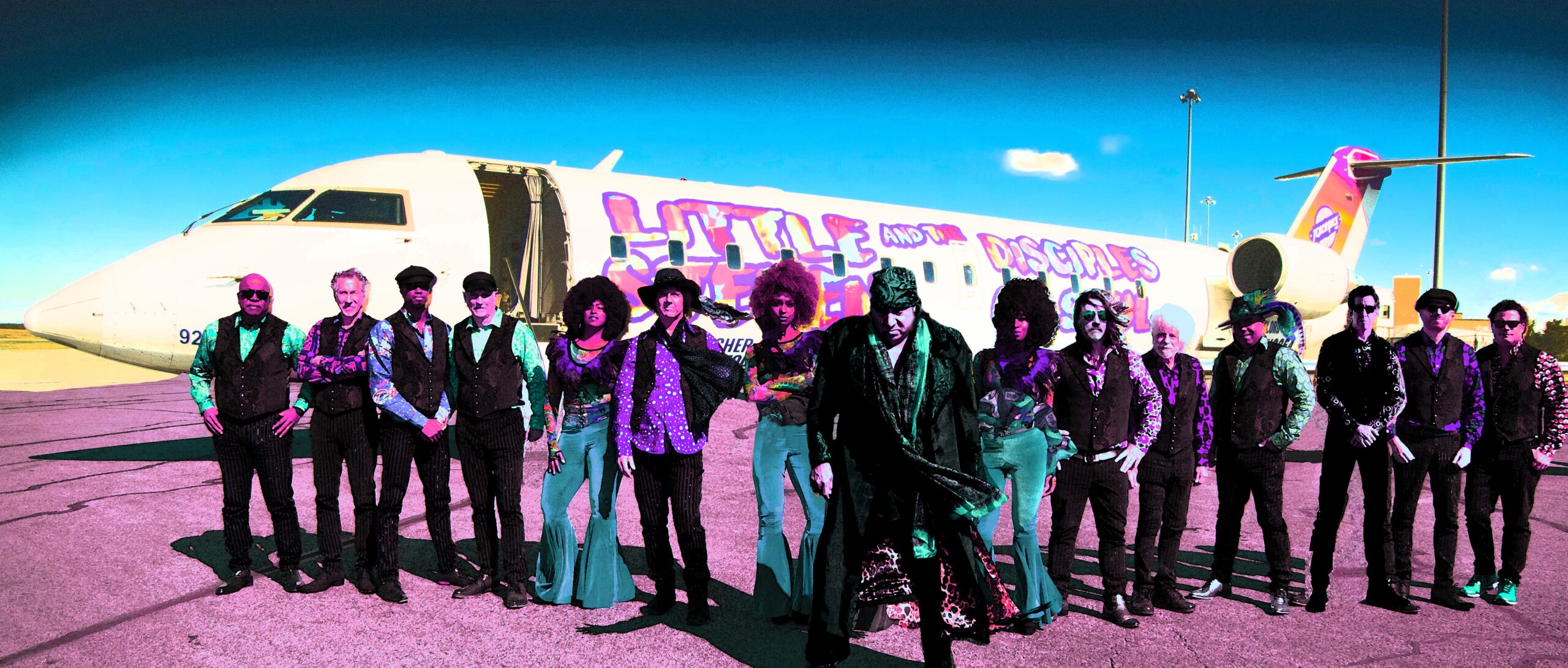 Little Stevie Van Zandt and the Disciples of Soul in front of their plane