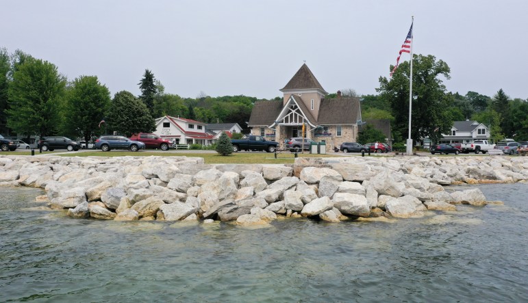 Buildings and large rocks along the shoreline of Lake Michigan in Ephraim, Wis.