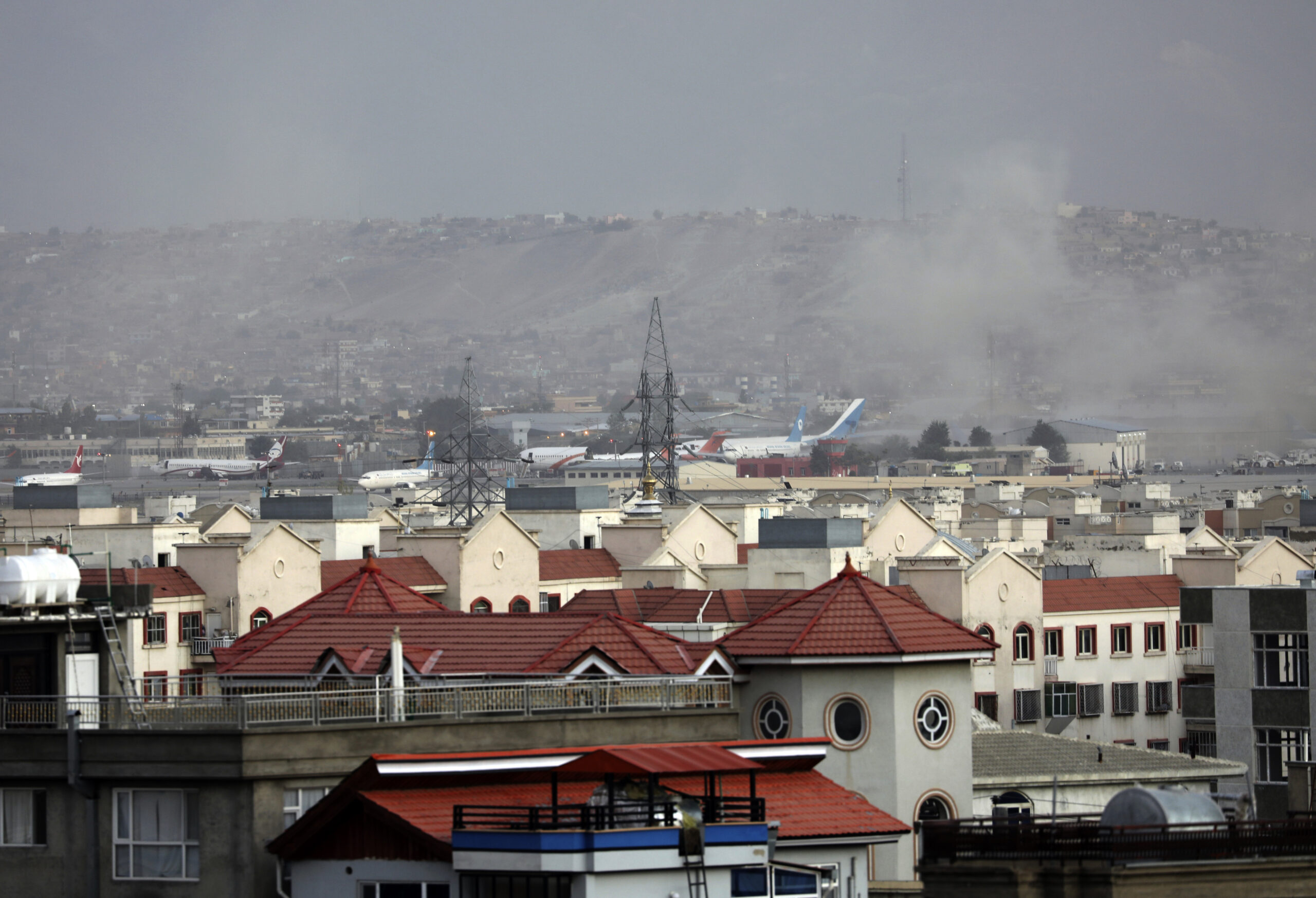 Smoke rises from a deadly explosion outside the airport in Kabul, Afghanistan