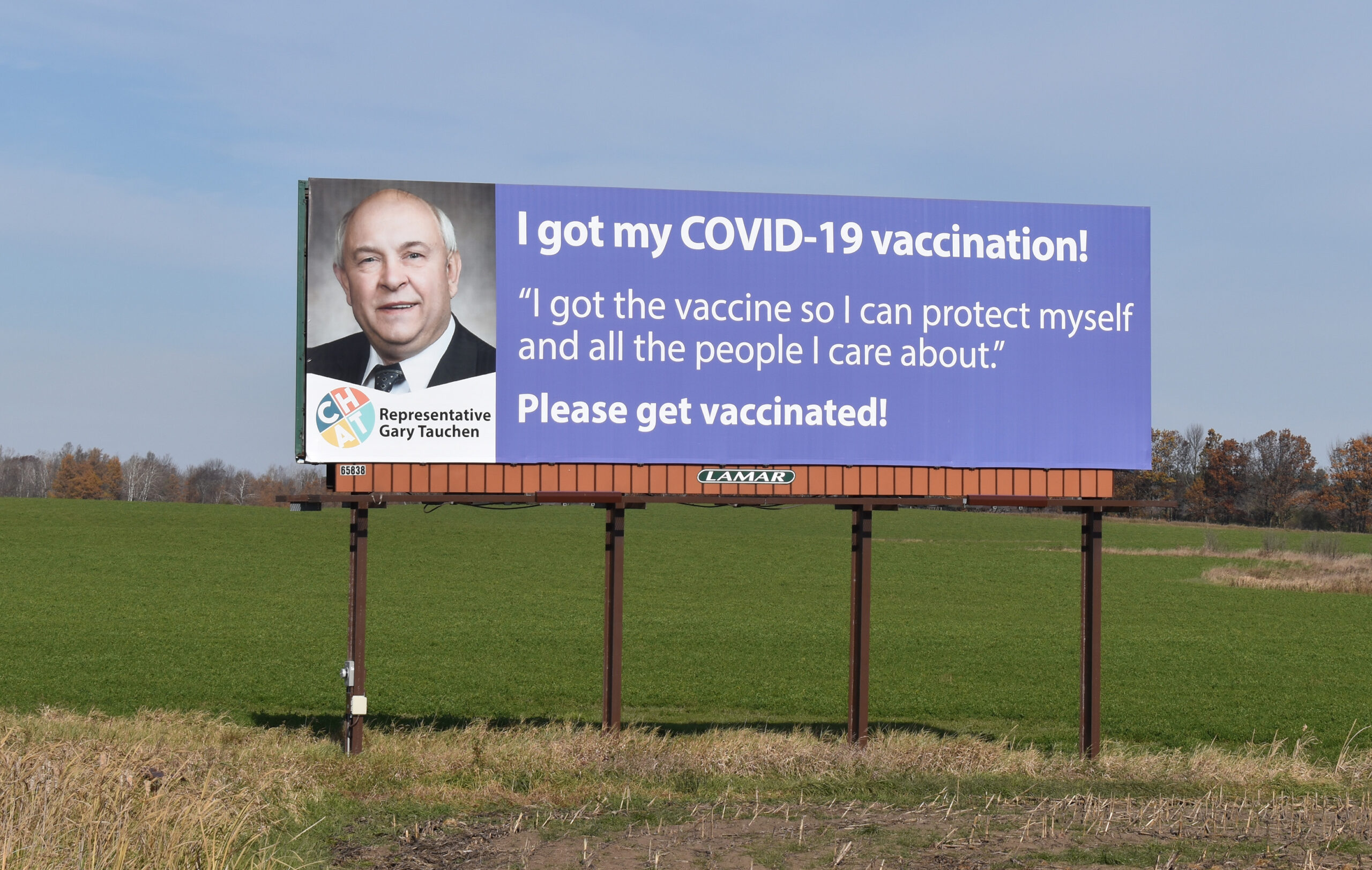 Rep. Gary Tauchen appears on a billboard encouraging COVID-19 vaccination in Shawano County