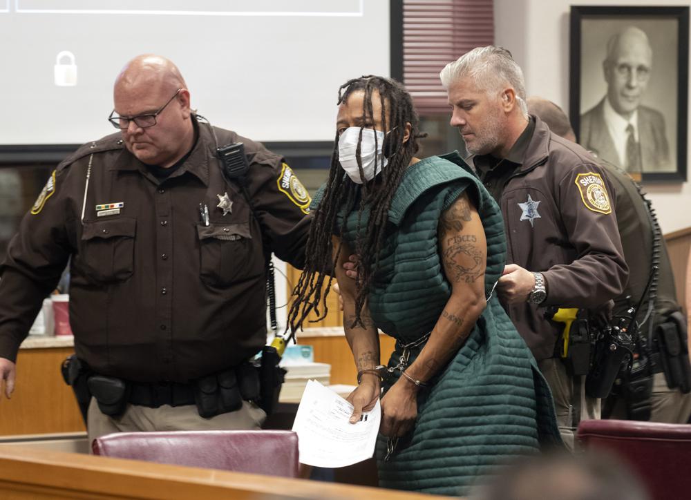 Darrell Brooks, center, is escorted out of the courtroom after making his initial appearance