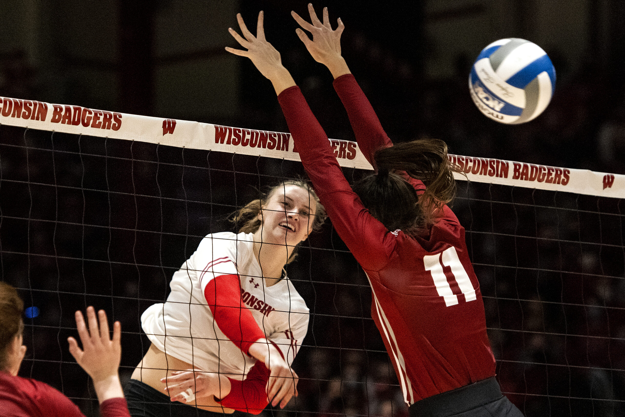The ball flies past a Colgate defender after a spike.
