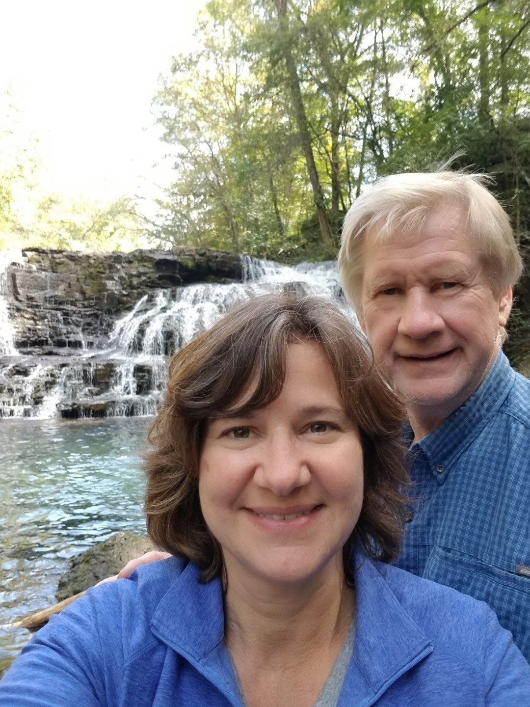 Geri Lynn and Jim Harju in front of a waterfall