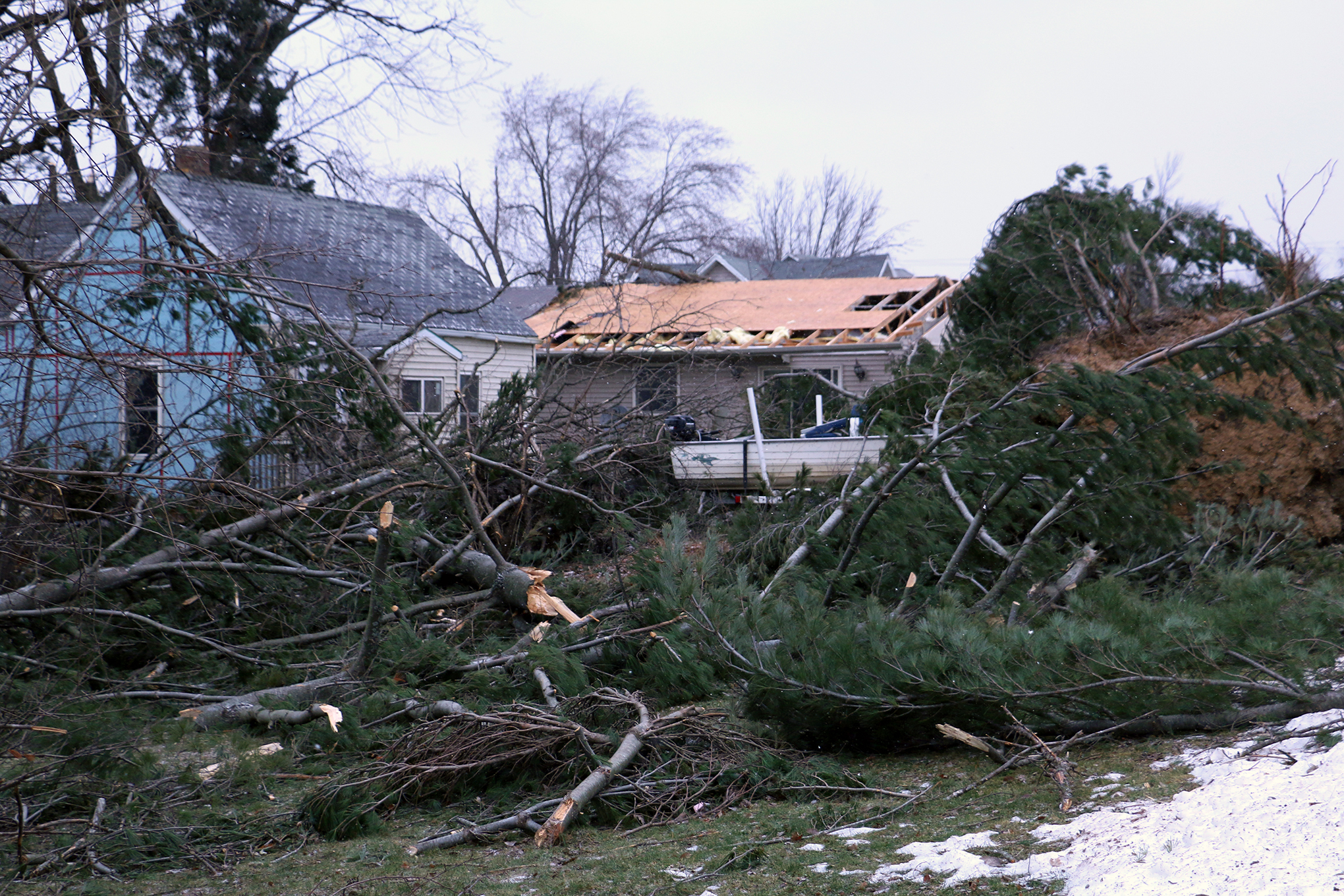 Storm damage, including downed trees, is seen in Stanley, Wis