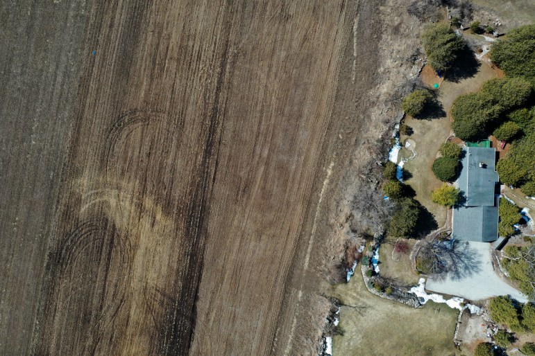 the house owned by Arlin and Mary Lou Karnopp near Luxemburg backs up to farm fields where manure is spread on the land