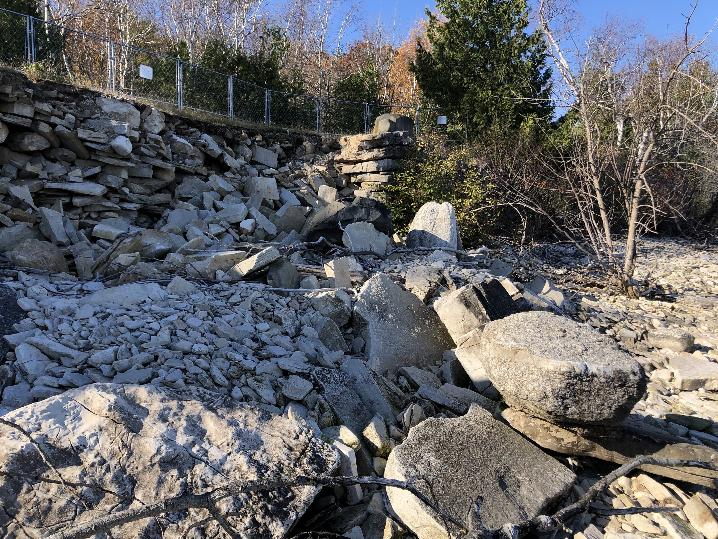 An eroded section of road and shoreline is shown at Potawatomi State Park near Sturgeon Bay