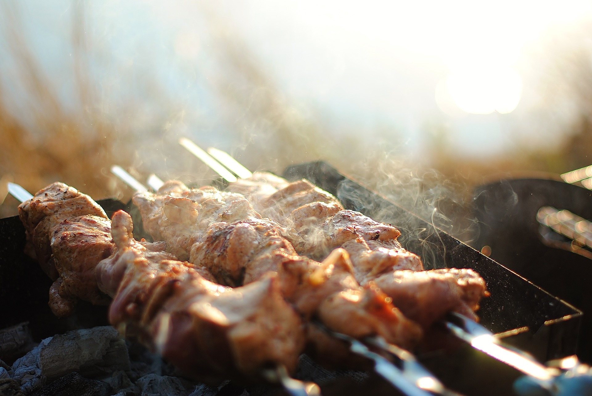 Meat skewers on grill.