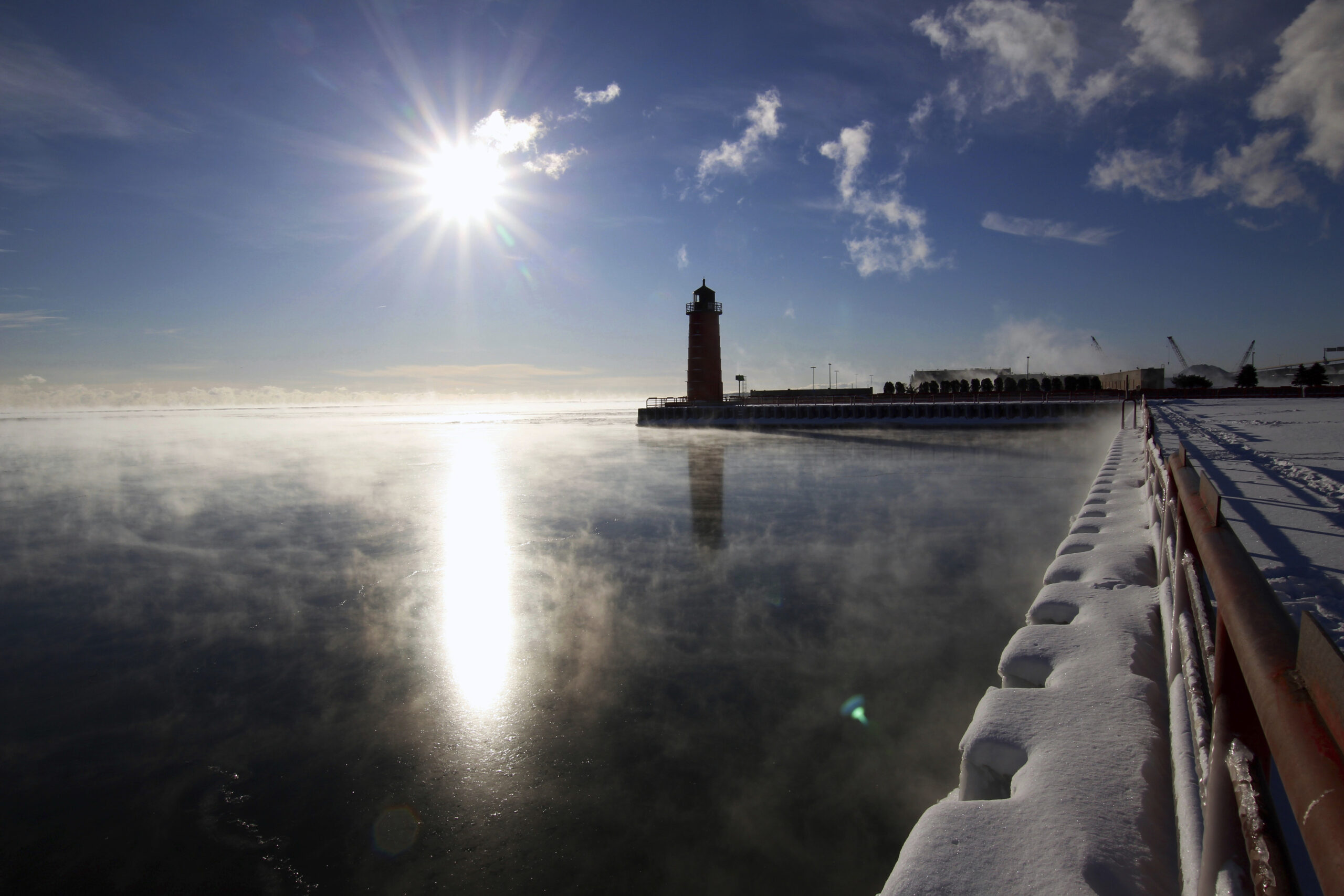 Steam rises from Lake Michigan during a cold winter day