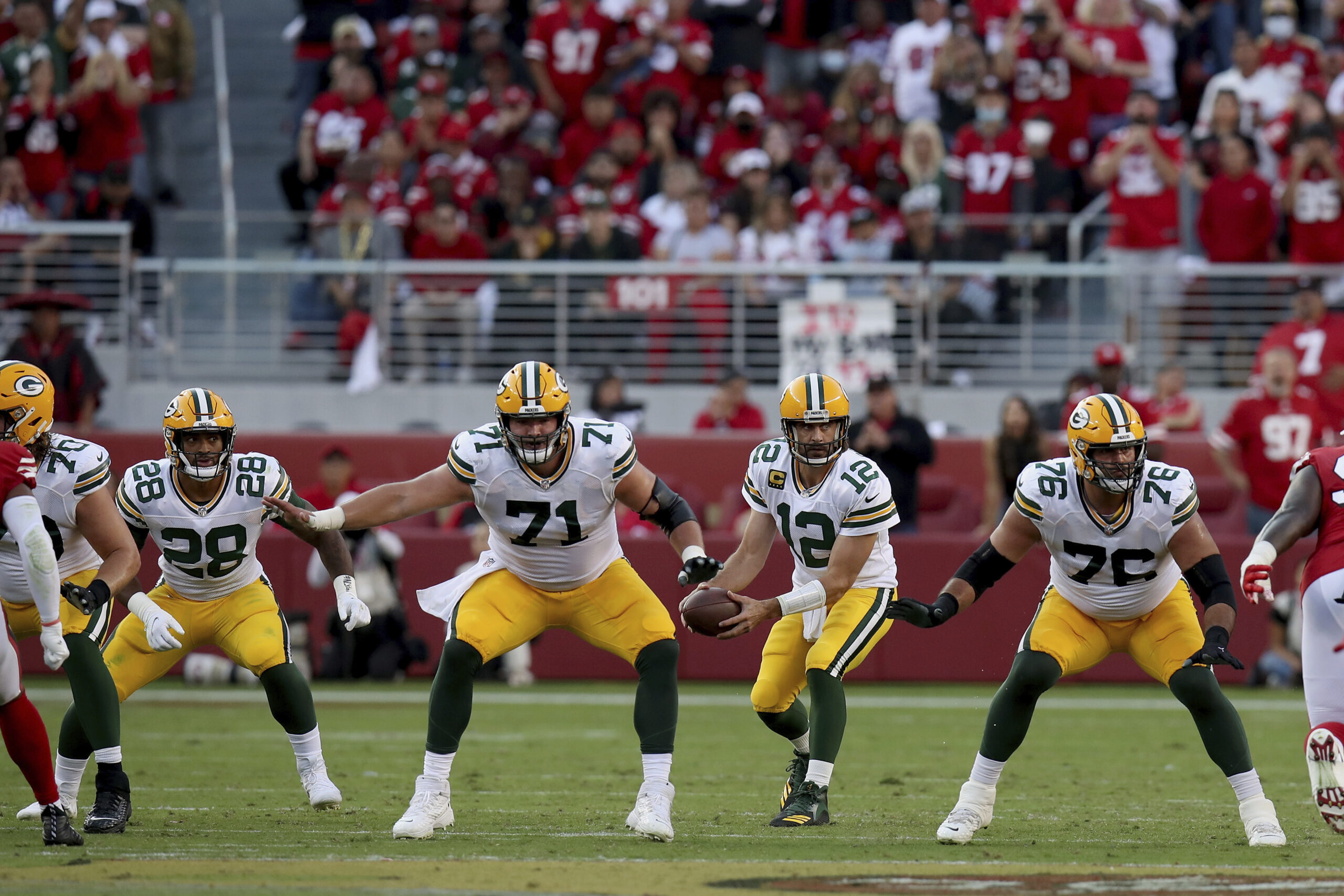 Green Bay Packers' Aaron Rodgers receives the snap during an NFL football game against the San Francisco 49ers