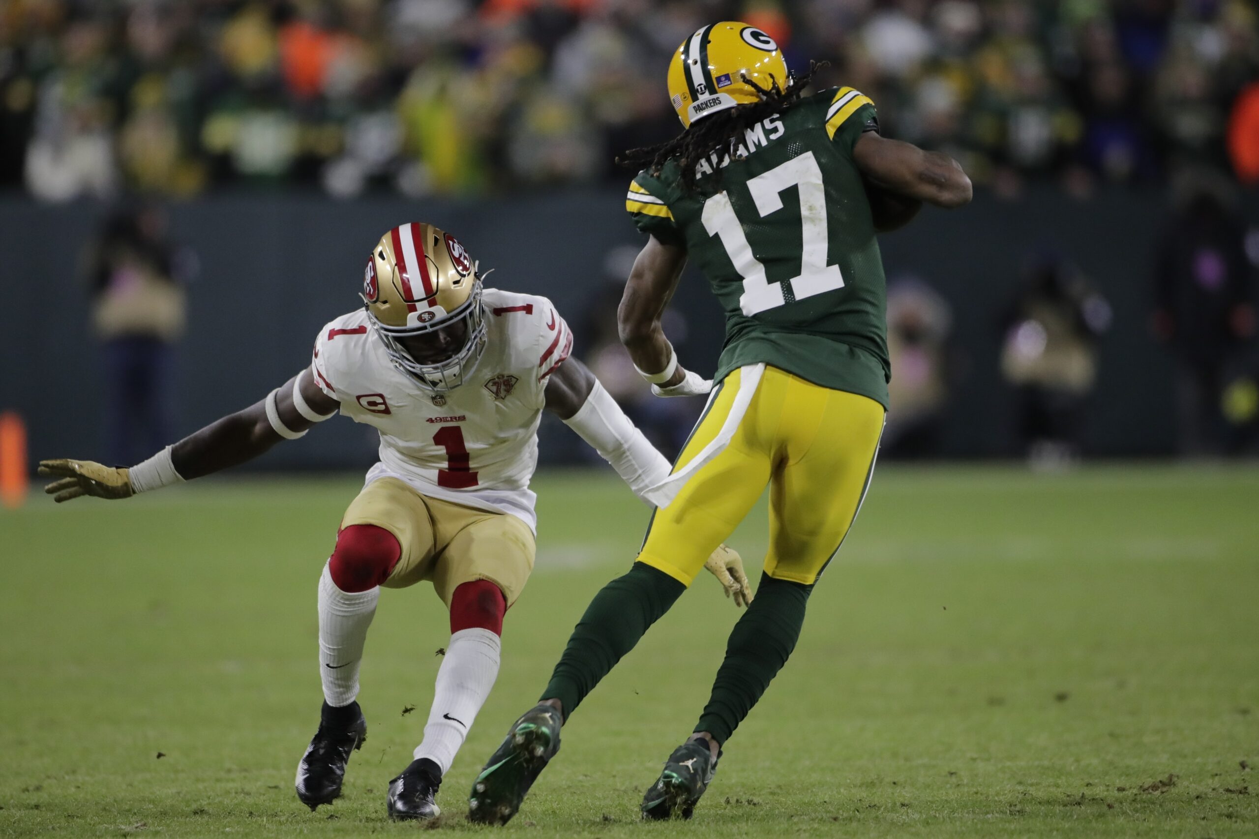 Green Bay Packers' Davante Adams tries to get past San Francisco 49ers' Jimmie Ward