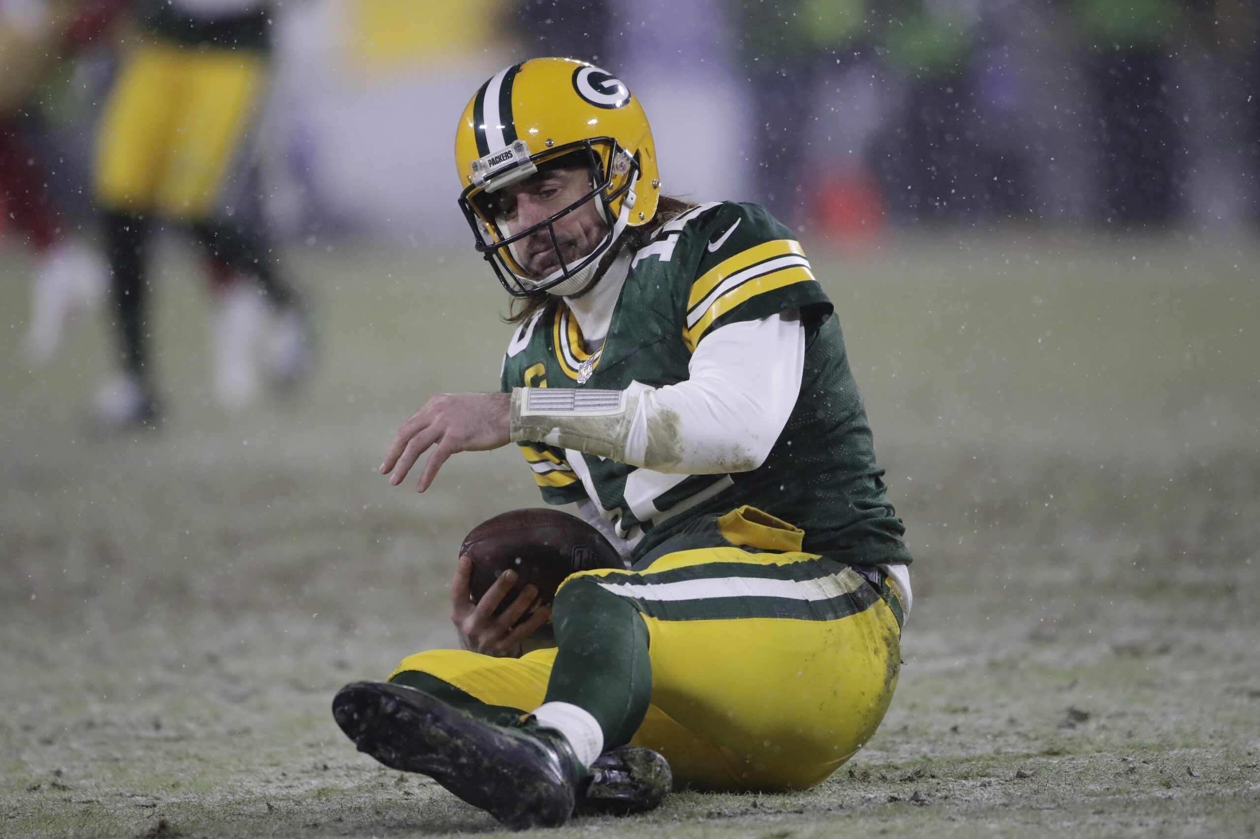 Green Bay Packers' Aaron Rodgers reacts after being sacked by San Francisco 49ers' Arik Armstead