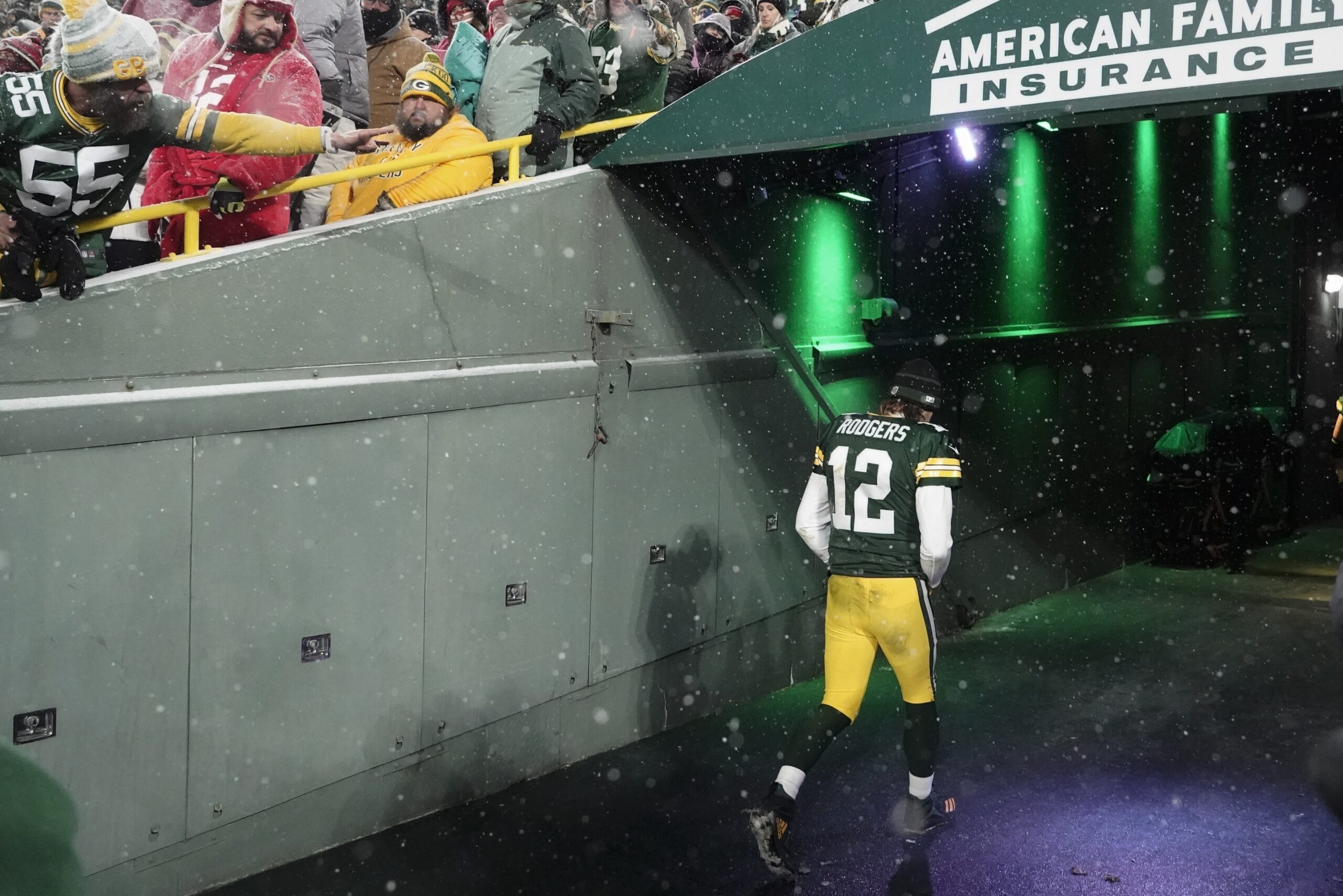 Green Bay Packers' Aaron Rodgers leaves the field after an NFC divisional playoff game