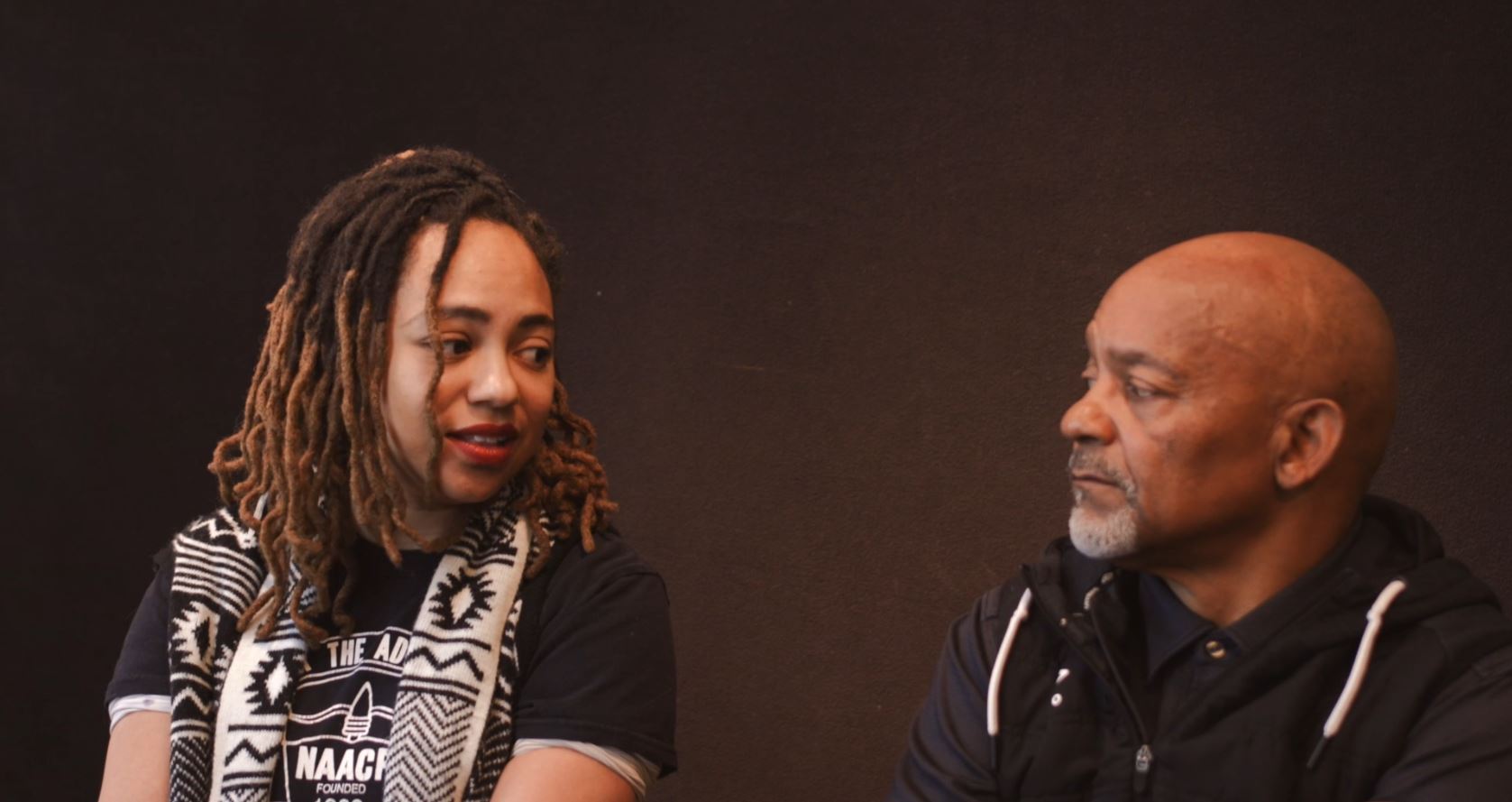 Classie Dudley, president of the Duluth Branch NAACP (left), and her father, Harrison Dudley, discuss present-day applications of the Rev. Martin Luther King's political advocacy in the locally produced documentary, "Dr. King's Words Into Actions."