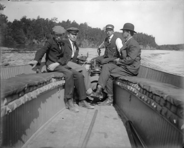 Four men boating in Wisconsin Dells