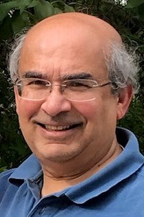 Sanjay Limaye smiling for a headshot photo