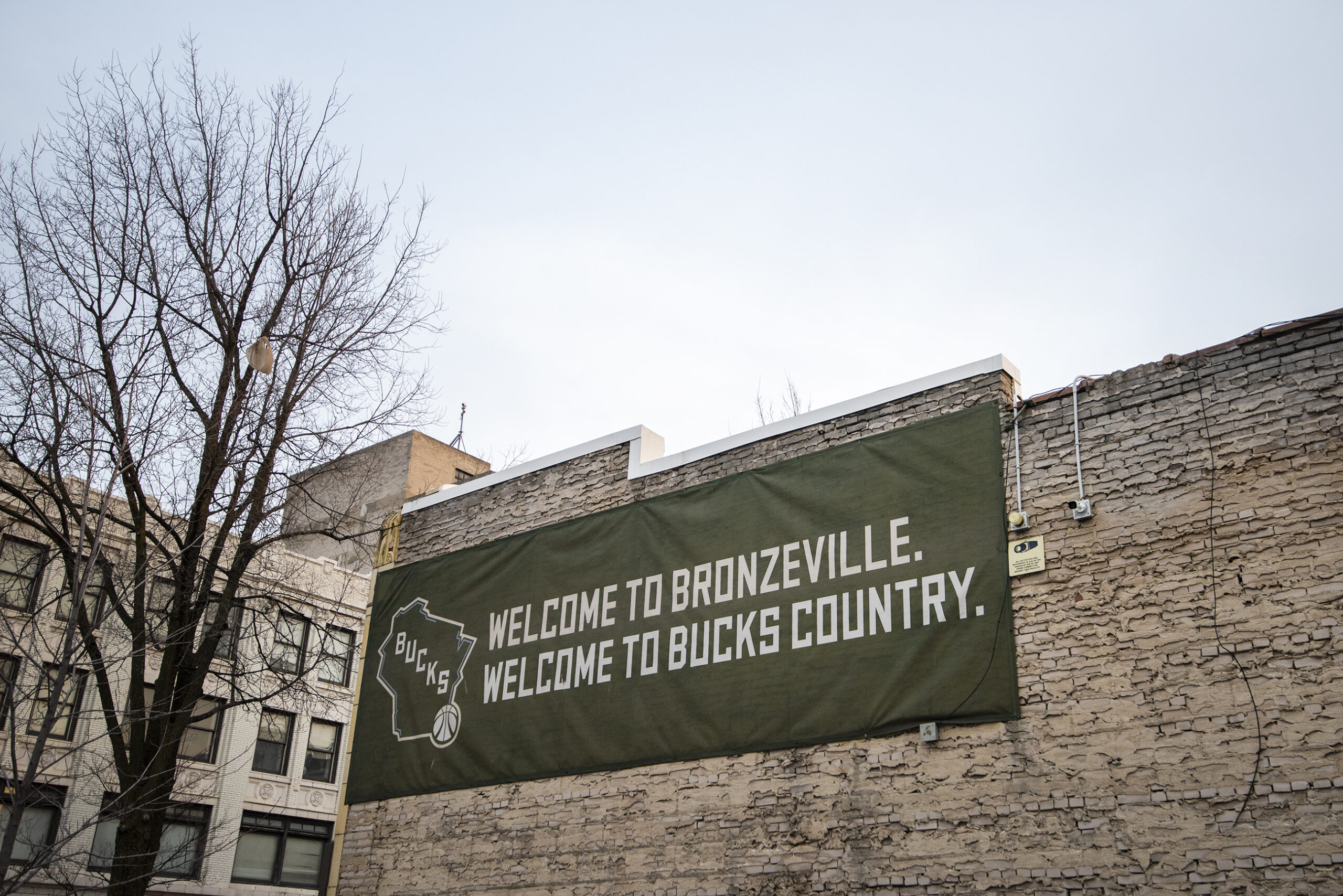 A green banner with the Bucks logo on it promotes Bronzeville.