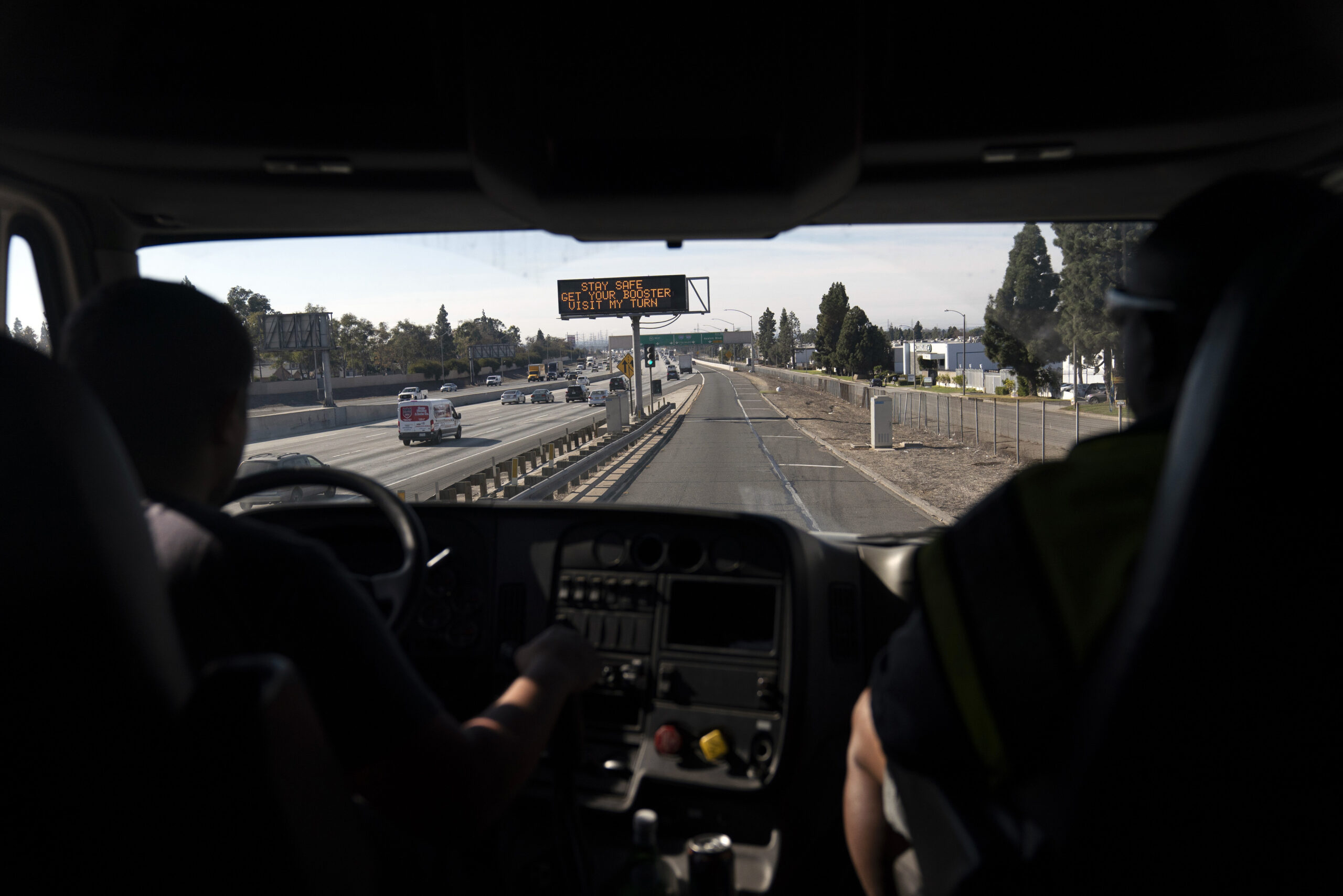 Student truck driver Edgar Lopez drives a practice truck along the freeway
