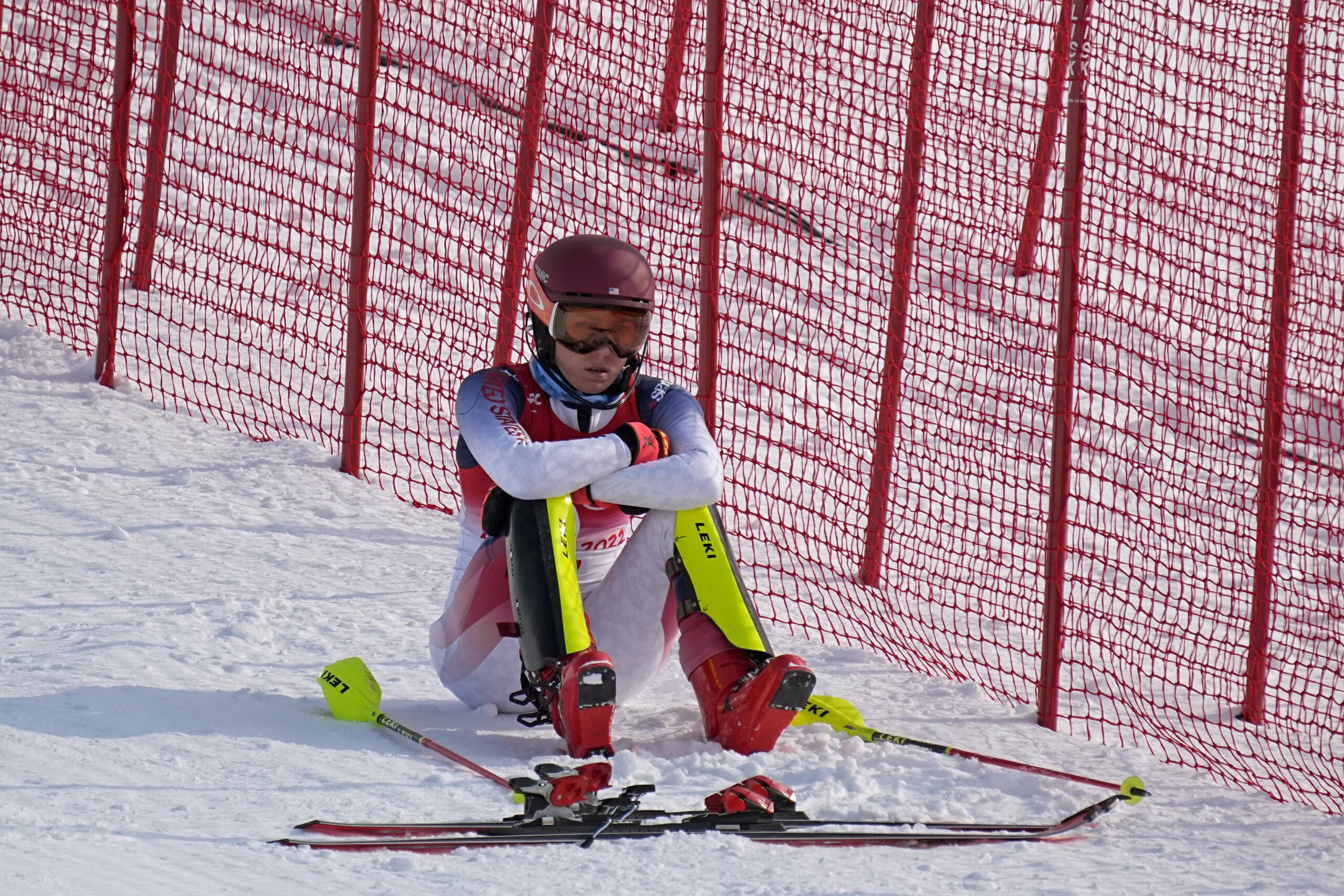 Mikaela Shiffrin, of the U.S, sits on the side of the course