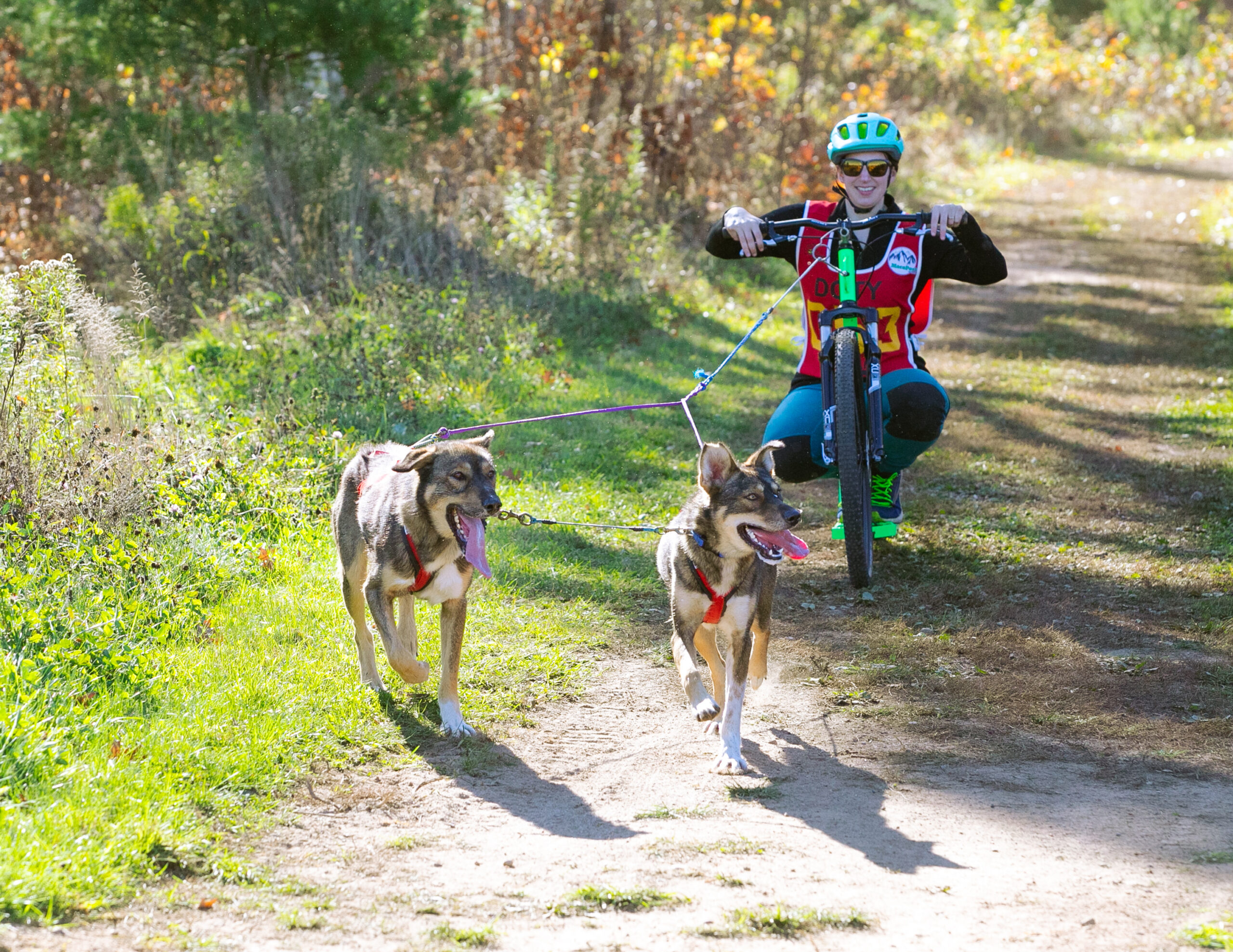 Blair Braverman rides a scooter during a dryland autumn event