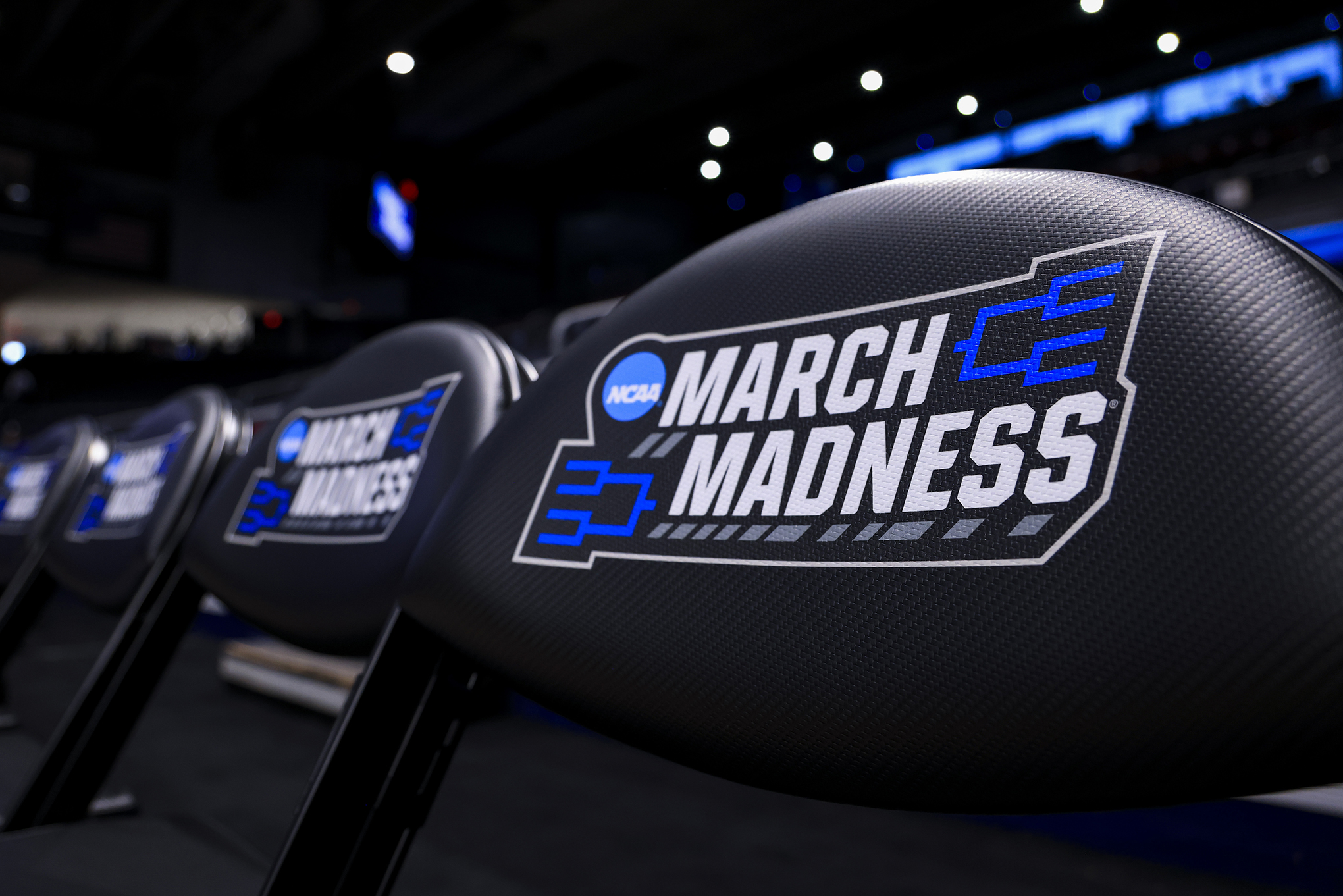 The NCAA March Madness logo is seen on a bench chairs