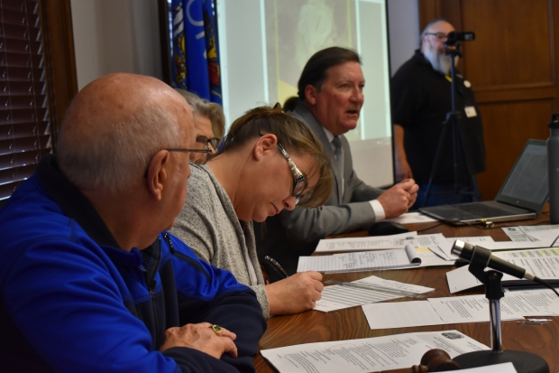 Clark Schroeder, far right, former administrator of Ashland County, advises board members