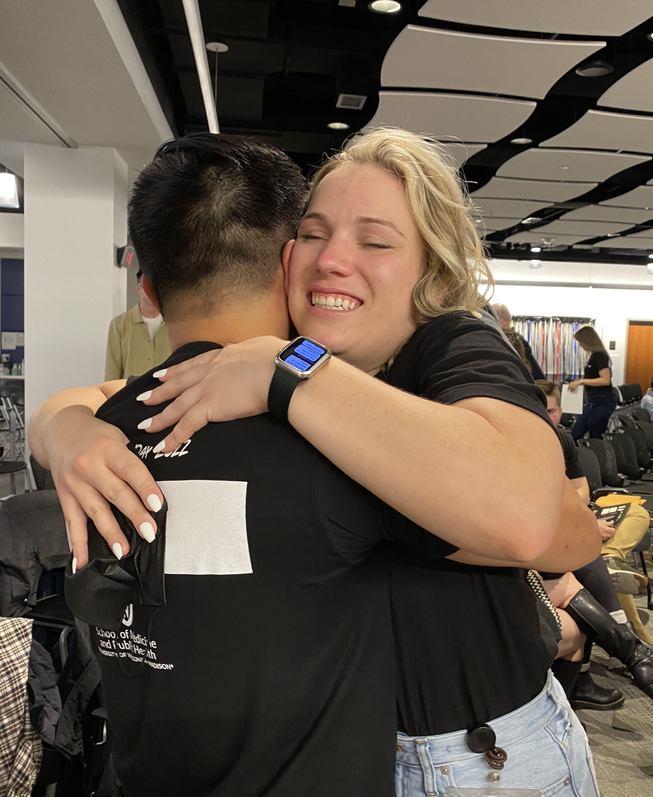 Elizabeth Maginot hugs a fellow UW School of Medicine and Public Health graduate during the 2022 Match Day event Friday