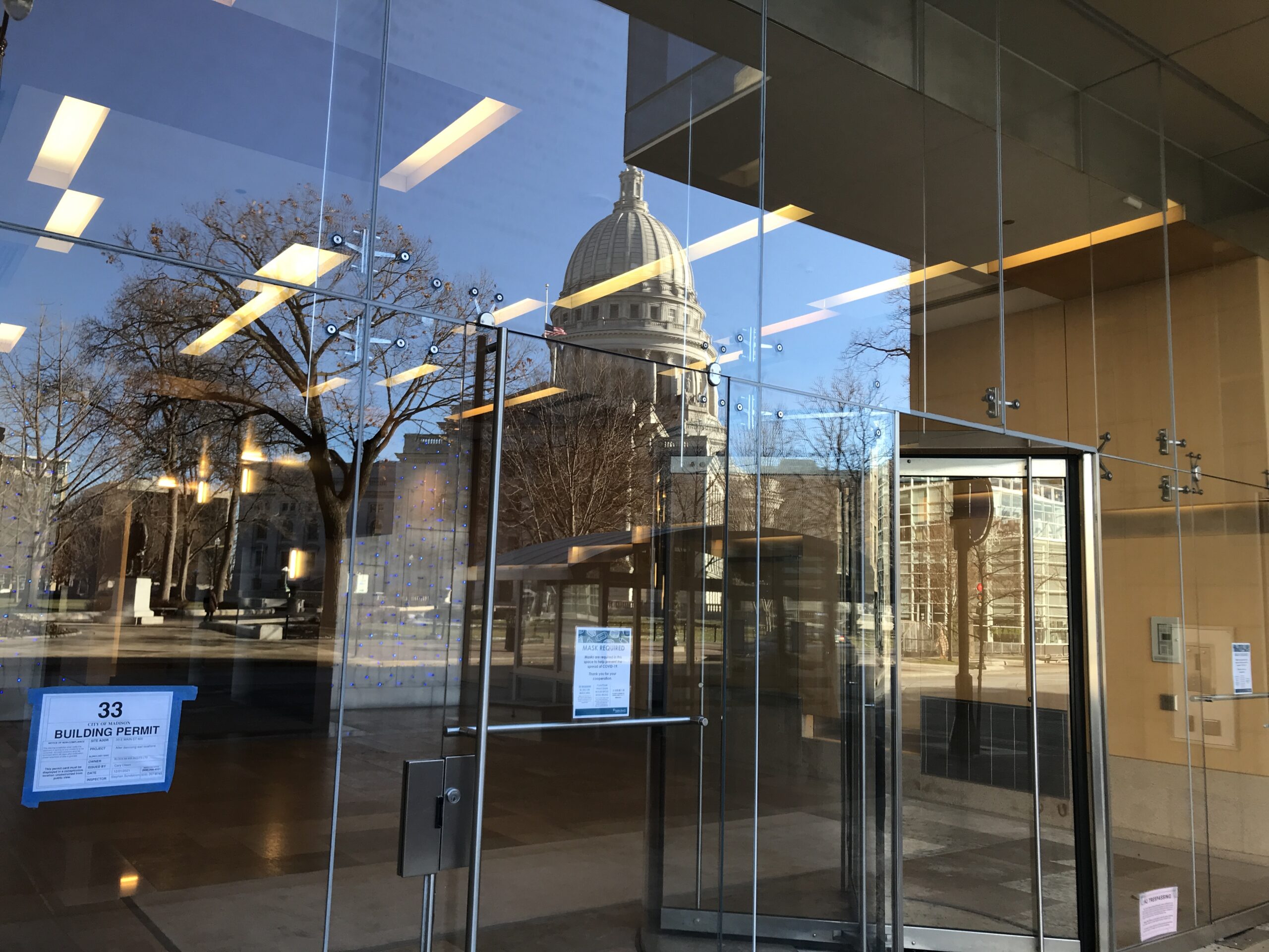 The reflection of the Wisconsin State Capitol in a nearby office building