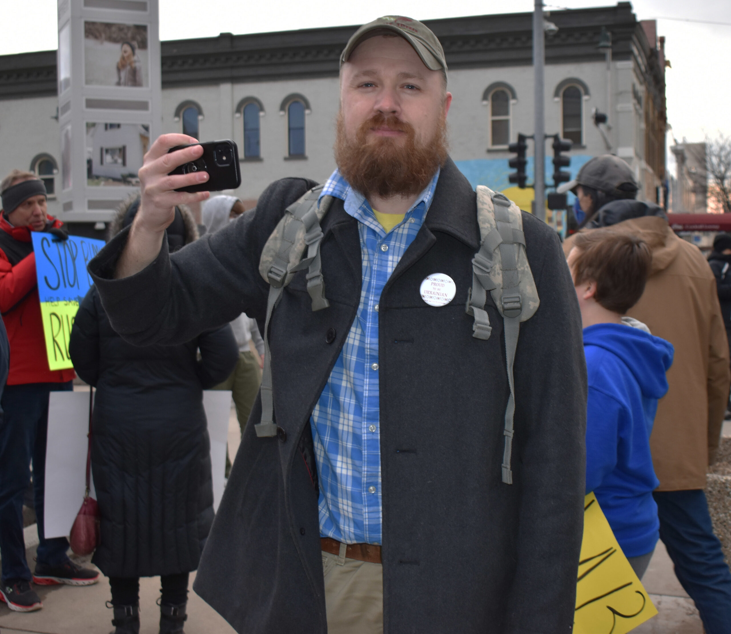 Jonathan Pylypiv livestreams to social media from the rally and donation event for Ukraine on Appleton's Houdini Plaza