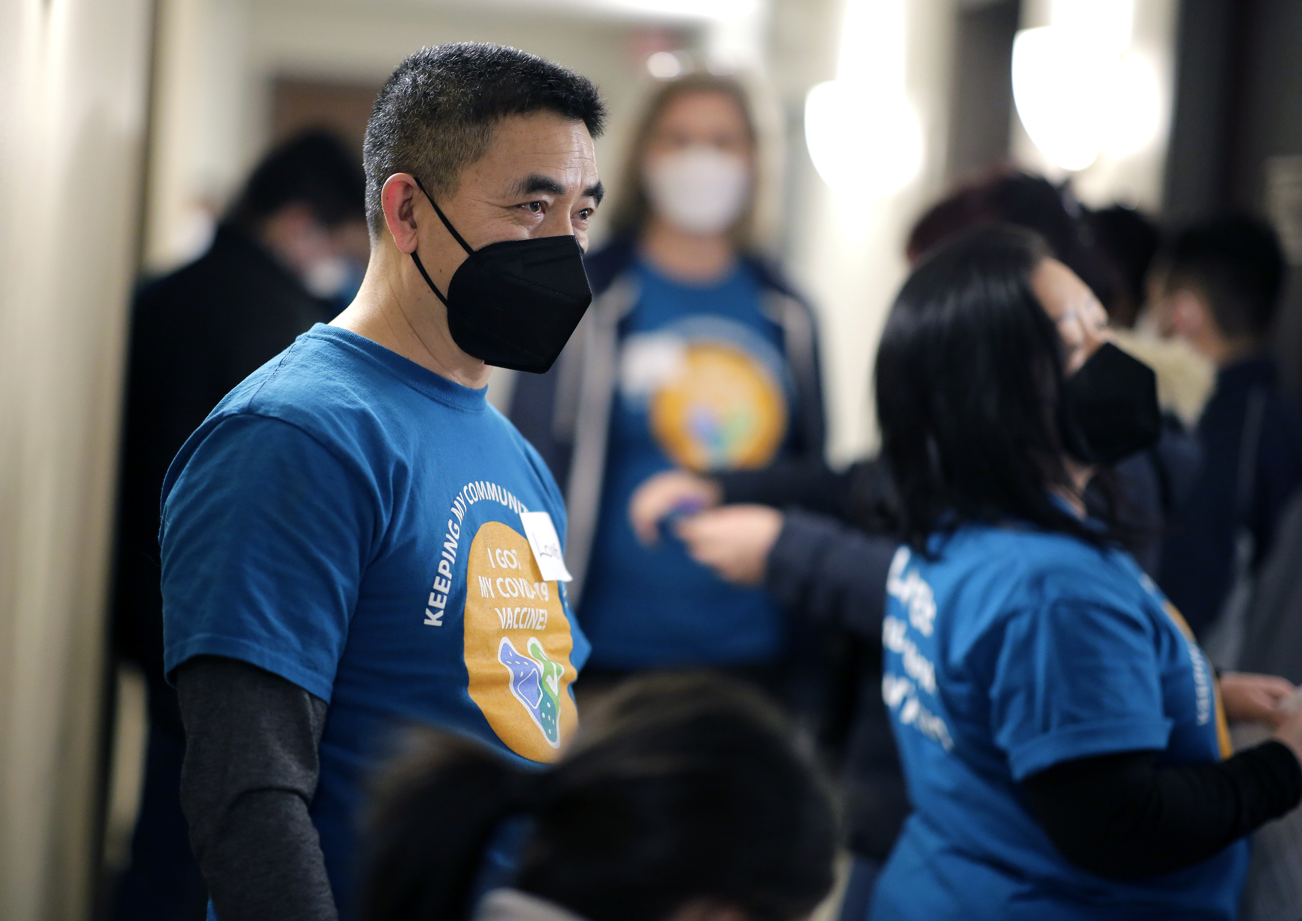 A man stands at an event for COVID-19 vaccinations