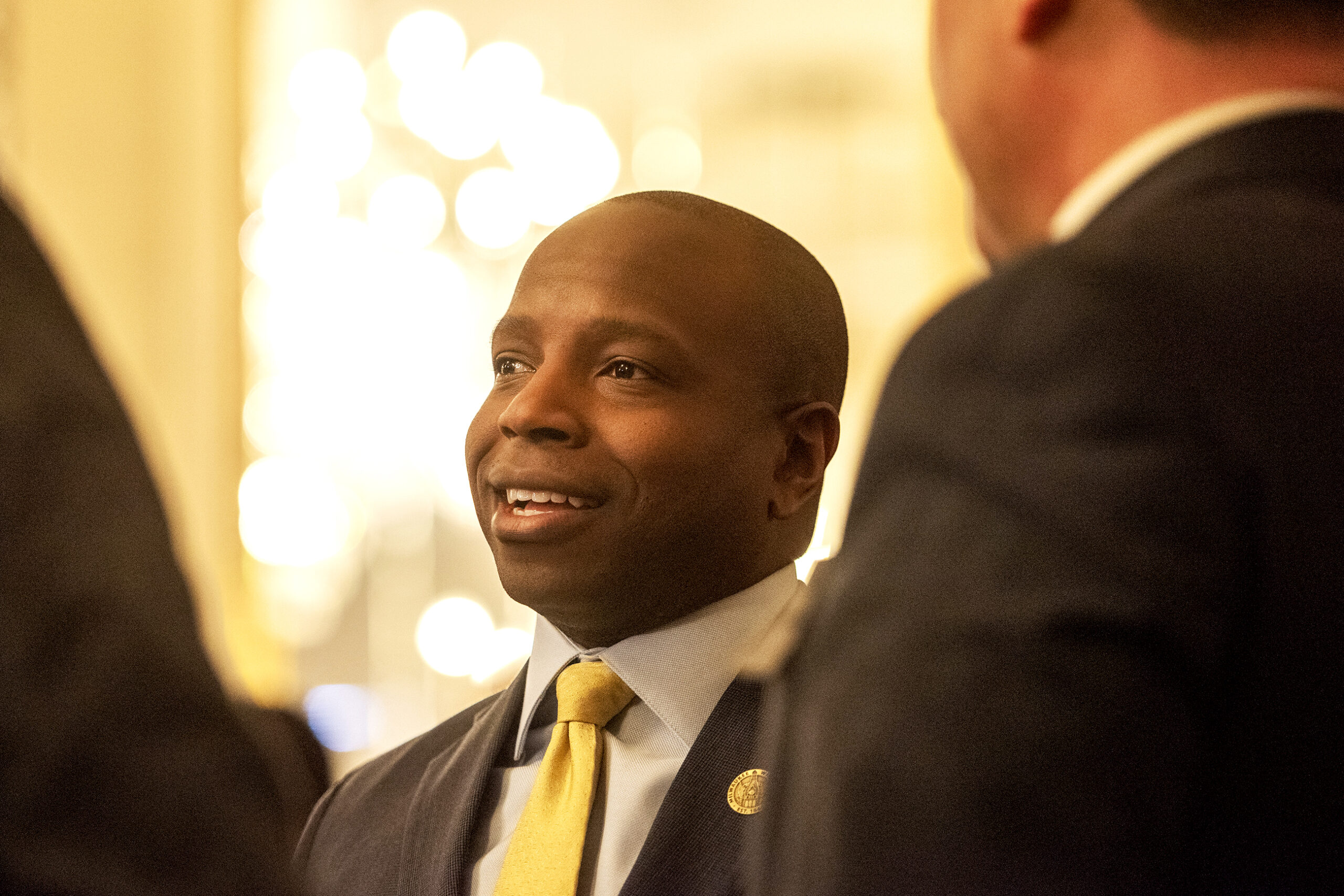 Cavalier Johnson smiles as he speaks to guests