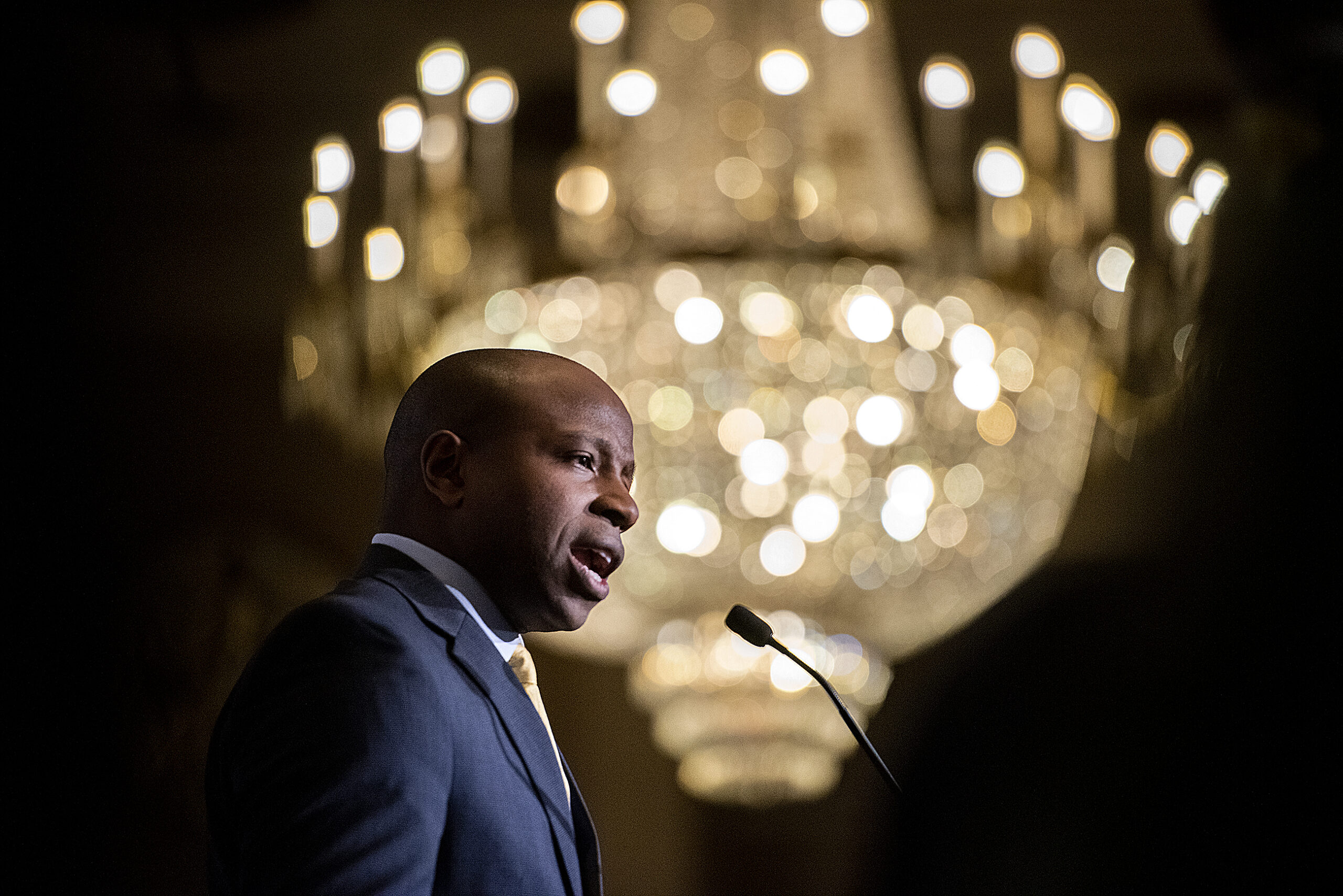 A large chandelier is the backdrop as Cavalier Johnson speaks after his election win.