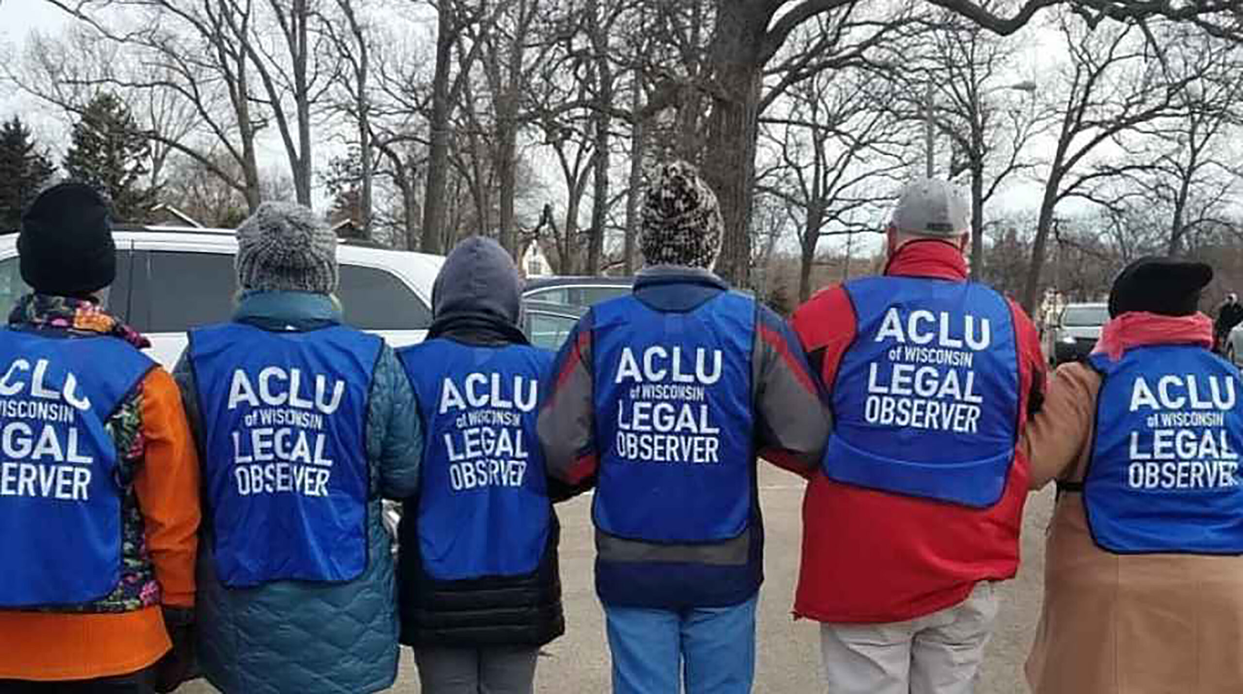Legal observers from the American Civil Liberties Union of Wisconsin prepare for an event