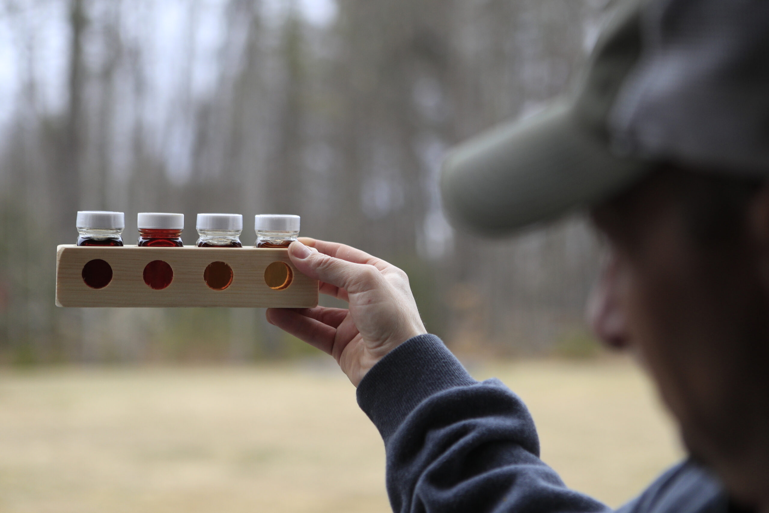 Scott Dunn gauges the grade of maple syrup.