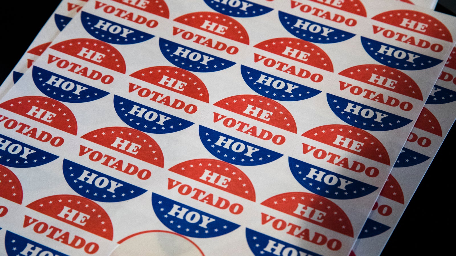Stickers that read "He Votado Hoy," which means "I voted today" in Spanish